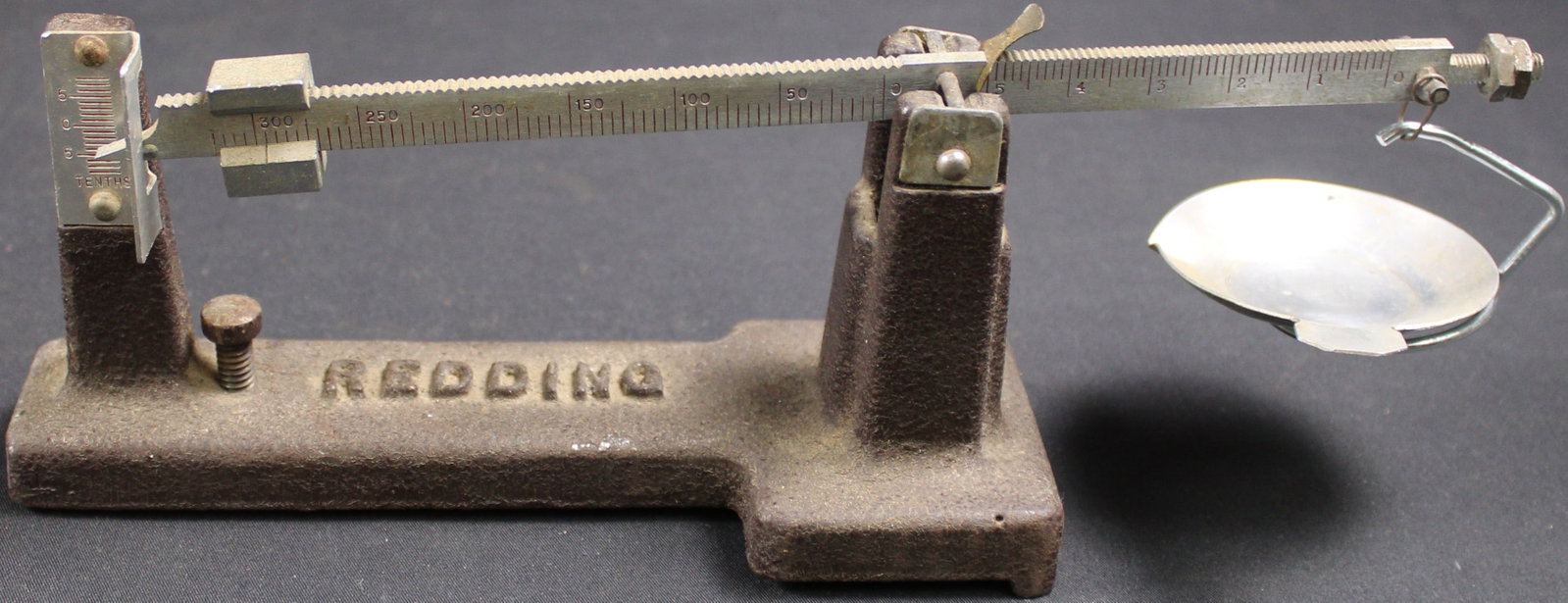 Redding Manufactured Reloading Scale (FMI): This Redding cast iron mechanical balance beam powder and bullet scale typically features a 325-grain capacity with sensitivity and precision down to 1/10 of a grain. Overall this item is in fair to g