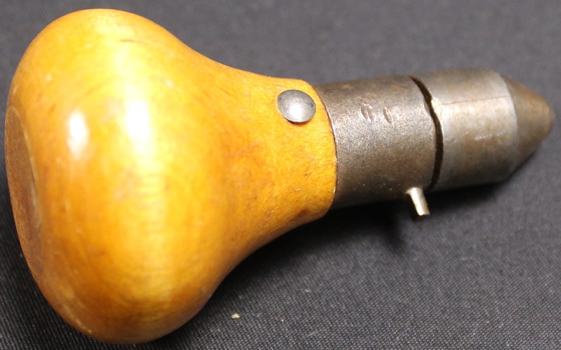 Die Cast Bullet Mould Hand Tool (FMI): This item is a hardwood handle suspected to go with a hollow base .45 caliber mould. This handle is in great shape and shows very little signs of use. Bidders are welcome to preview items in person