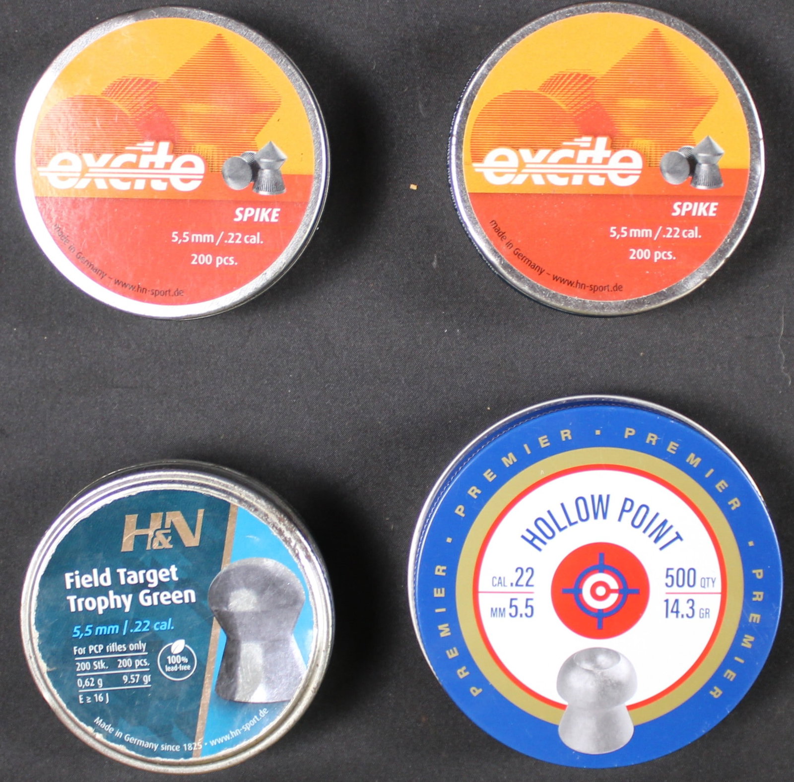 Group Lot: Four Cans of .22 Caliber Pellets (LOL): This group lot of .22 Cal pellets includes a can of Hollow point, two cans of spike shaped pellets, and a can of solid target pellets. All cans seem to be in good condition. Bidders are welcome to