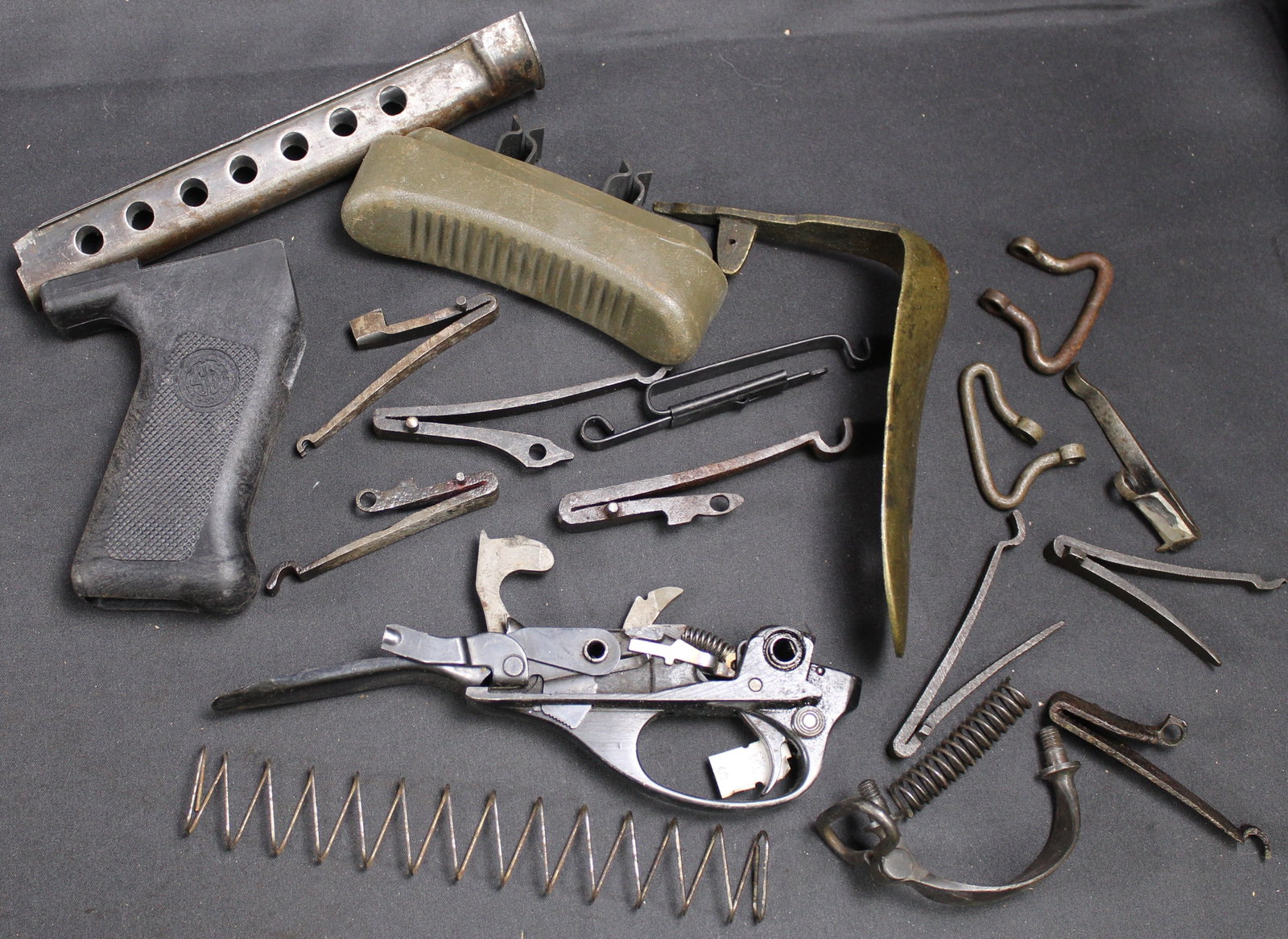 Group Lot: Firearms Parts Lot (FMI): Description coming soon Bidders are welcome to preview items in person during our normal operating hours Tuesday through Saturday 11am-6pm. Estimated shipping parcel size (LxWxH) 10 inches x 8 inches