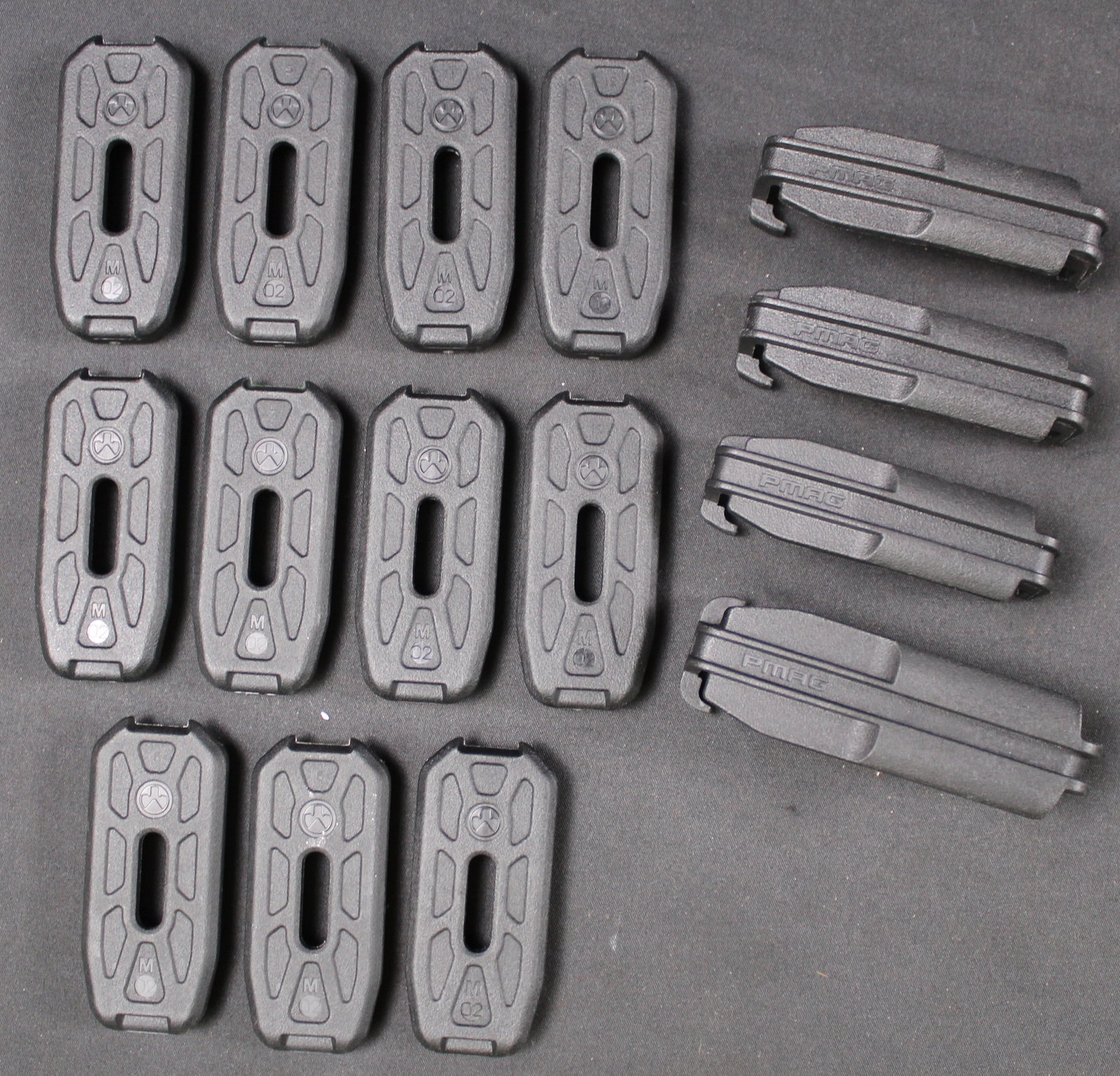 Group Lot: MAGPUL Follower Covers and Bottom Plates (DMS): These MAGPUL Follower Covers (4) and Bottom Plates (11) are overall in good condition showing very little use. Bidders are welcome to preview items in person during our normal operating hours Tuesday
