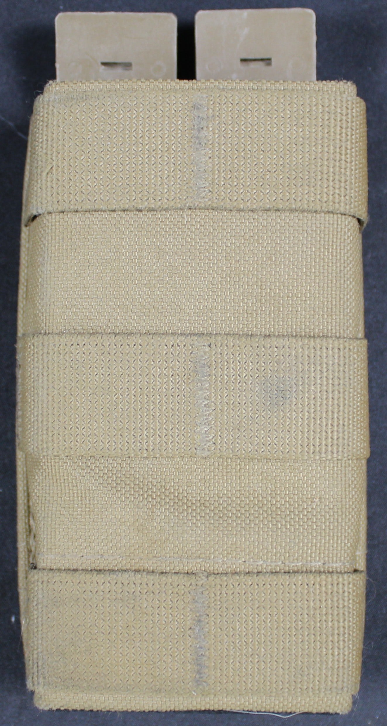 Khaki Tan Magazine Pouch (DMS): A Khaki Tan Magazine Pouch that fits standard AR magazines in overall good to very good condition showing very little wear. Bidders are welcome to preview items in person during our normal operating