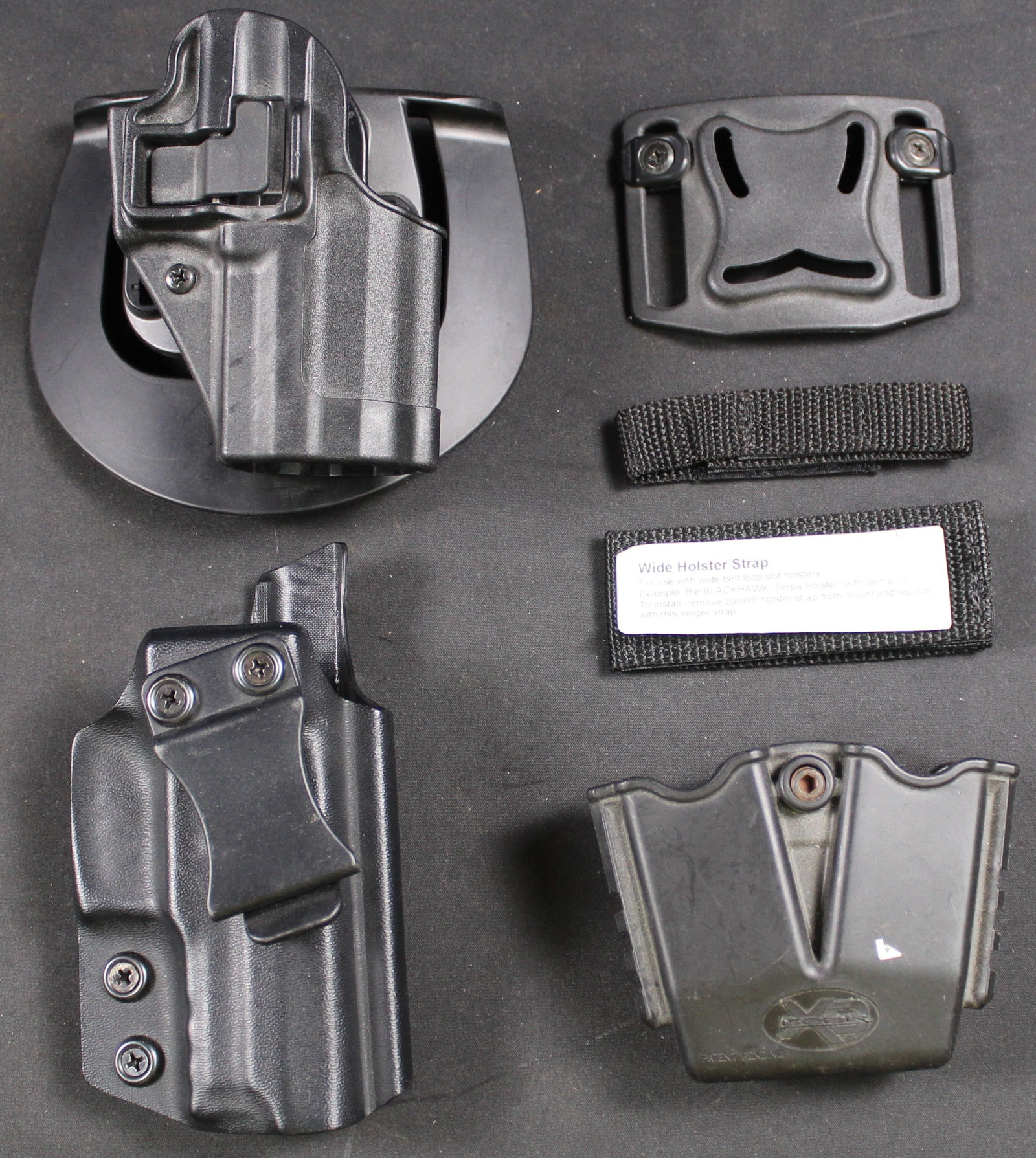 Group Lot: Pistol and Magazine Holsters (DMS): This group lot of pistol and magazine holsters contains 1 BLACKHAWK holster for a H&K P30. 1 custom holster with unknow make. 1 Springfield Armory magazine holster. This Lot is in goof condition as