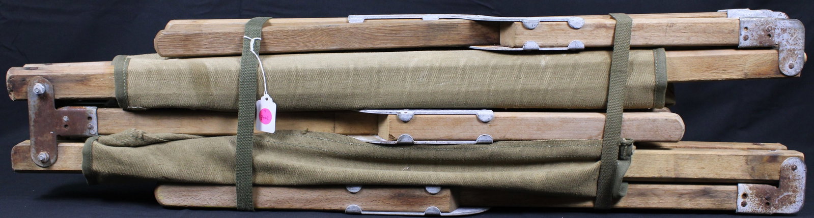 Vietnam Era Wood & Canvas Cot (PMC): Description coming soon! Bidders are welcome to preview items in person during our normal operating hours Tuesday through Saturday 11am-6pm. Estimated shipping parcel size (LxWxH) 18 inches x 18