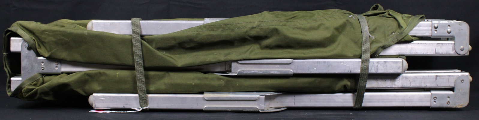 Standard Aluminum U.S. Cot (PMC): An aluminum and canvas us military cot. These cots have an 800 lbs rating and has an approximate size of 73" x 25" x 17". Overall this item is in good condition as the canvas looks intact and it has