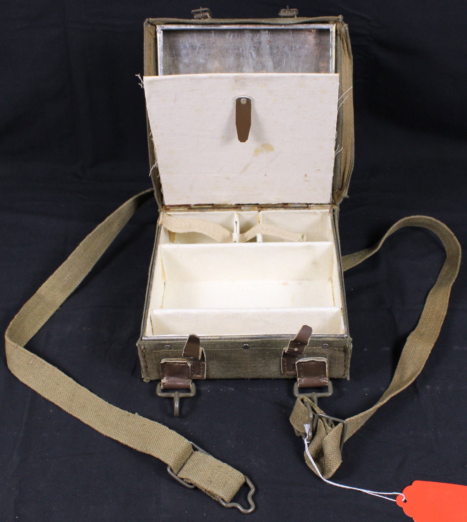 Italian Explosives Satchell (FMI): This Italian military WWII-era dynamite transport box is heavy for its size (8-1/2" square x 4" thick), and extremely sturdy. The outside is olive drab canvas-covered steel with (2) adjustable canvas