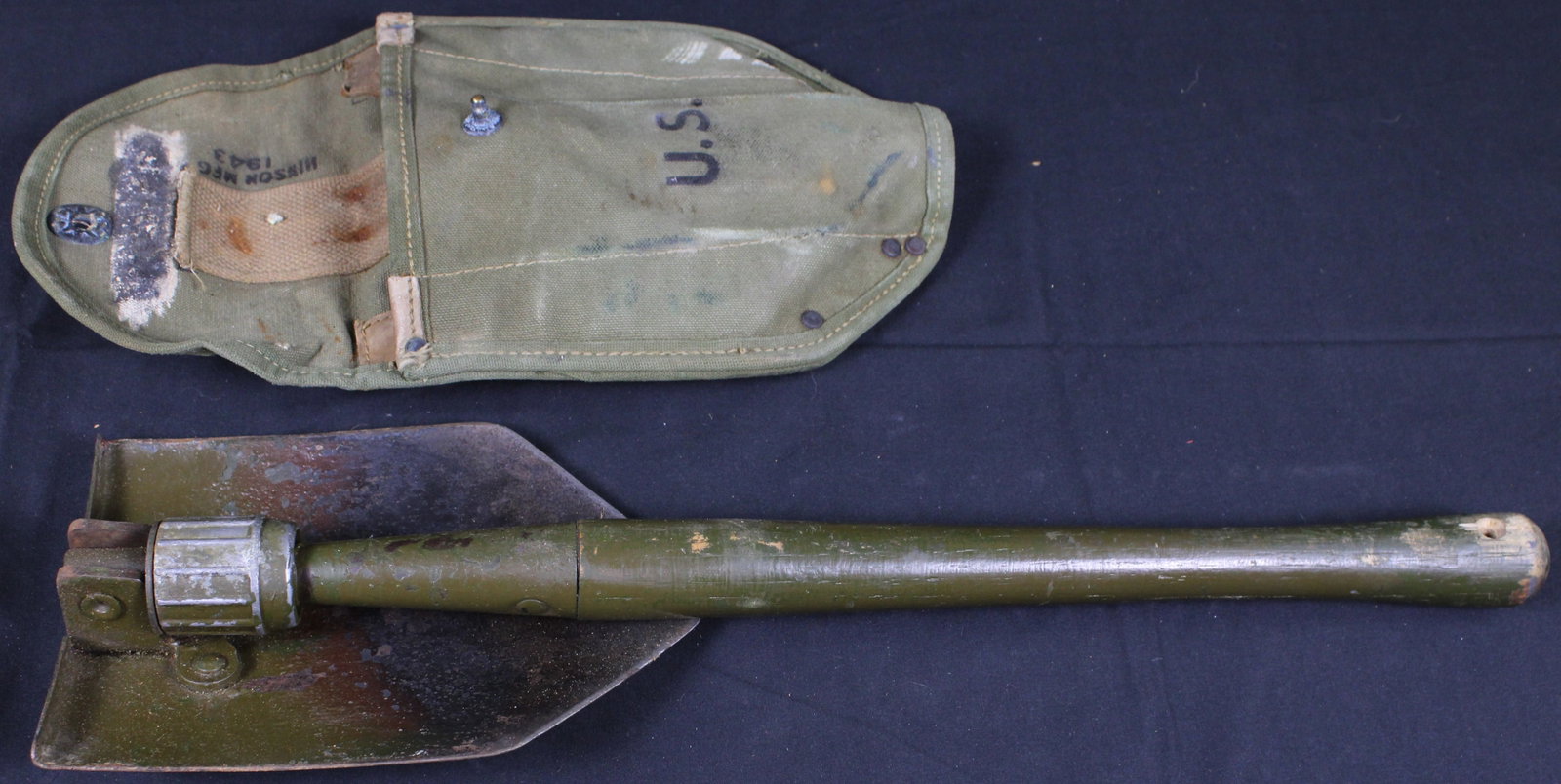 WWII USGI Minson Mfg 1943 U.S. Army Spade (BJT): Minson Mfg 1943 U.S. Army Spade. This item would be used for digging fighting holes or trenches. This lot is in good condition showing normal signs of wear. Bidders are welcome to preview items in