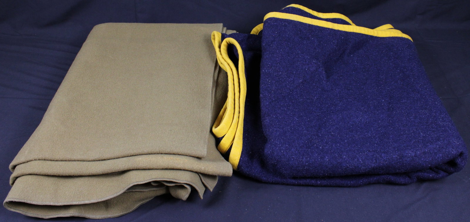 Blue Olympic Champion Blanket & Green Wool Blanket (BJT): Description coming soon! Bidders are welcome to preview items in person during our normal operating hours Tuesday through Saturday 11am-6pm. Estimated shipping parcel size (LxWxH) 14 inches x 14