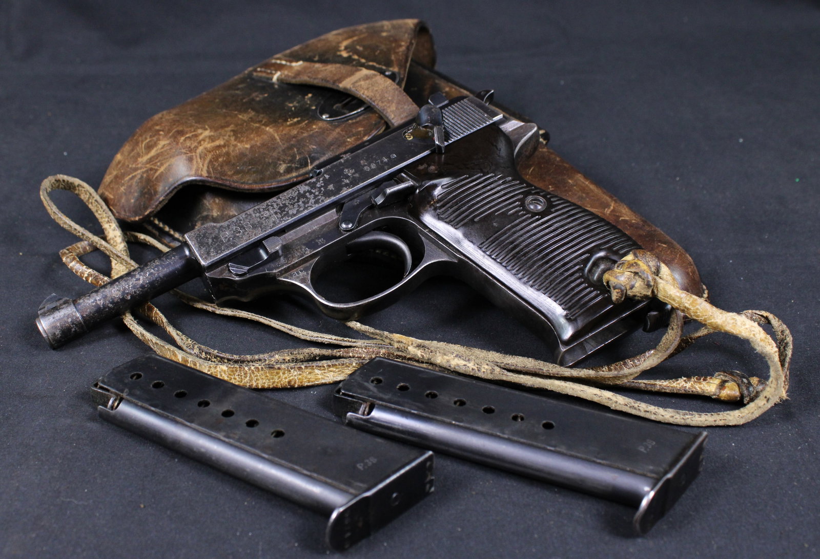 Captured Walther P.38 9mm Semi-Automatic Pistol W/ Two Matching Magazines and Original Holster (PPR): Description coming soon! Bidders are welcome to preview items in person during our normal operating hours Tuesday through Saturday 11am-6pm. Estimated shipping parcel size (LxWxH) 14 inches x 14