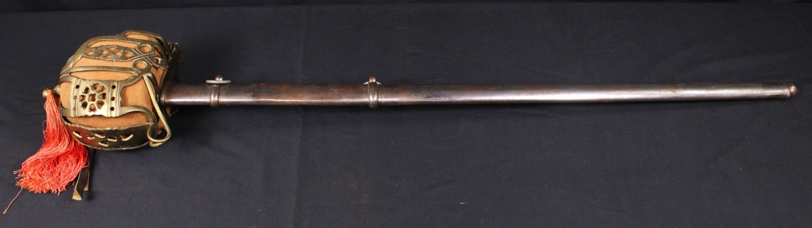 Ornate Indian Embossed Basket Hilted Backsword and Sheath (JAA): Description coming soon! Bidders are welcome to preview items in person during our normal operating hours Tuesday through Saturday 11am-6pm. Estimated shipping parcel size (LxWxH) 48 inches x 8