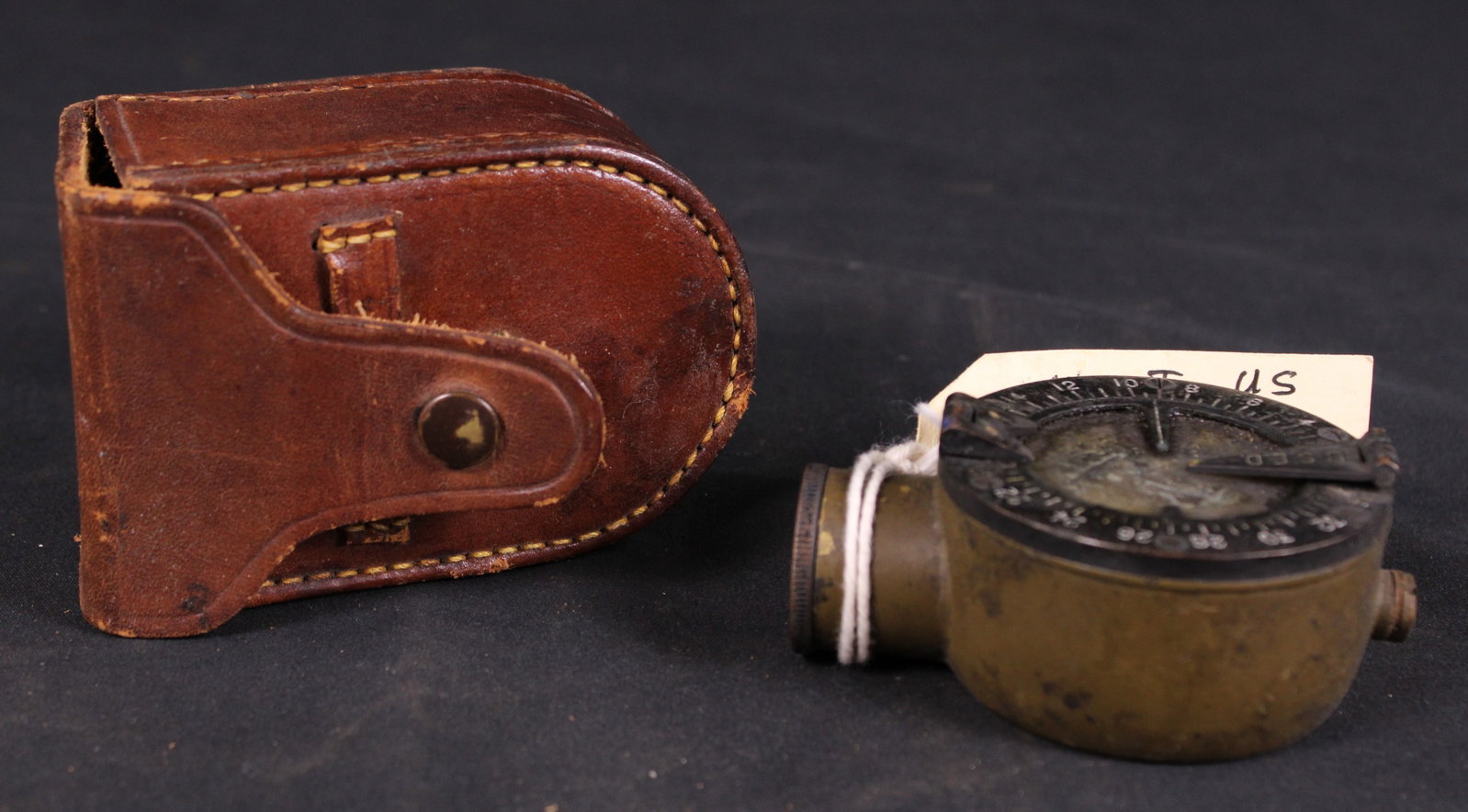 WWI Era Marching Compass (FMI): Description coming soon! Bidders are welcome to preview items in person during our normal operating hours Tuesday through Saturday 11am-6pm. Estimated shipping parcel size (LxWxH) 10 inches x 10