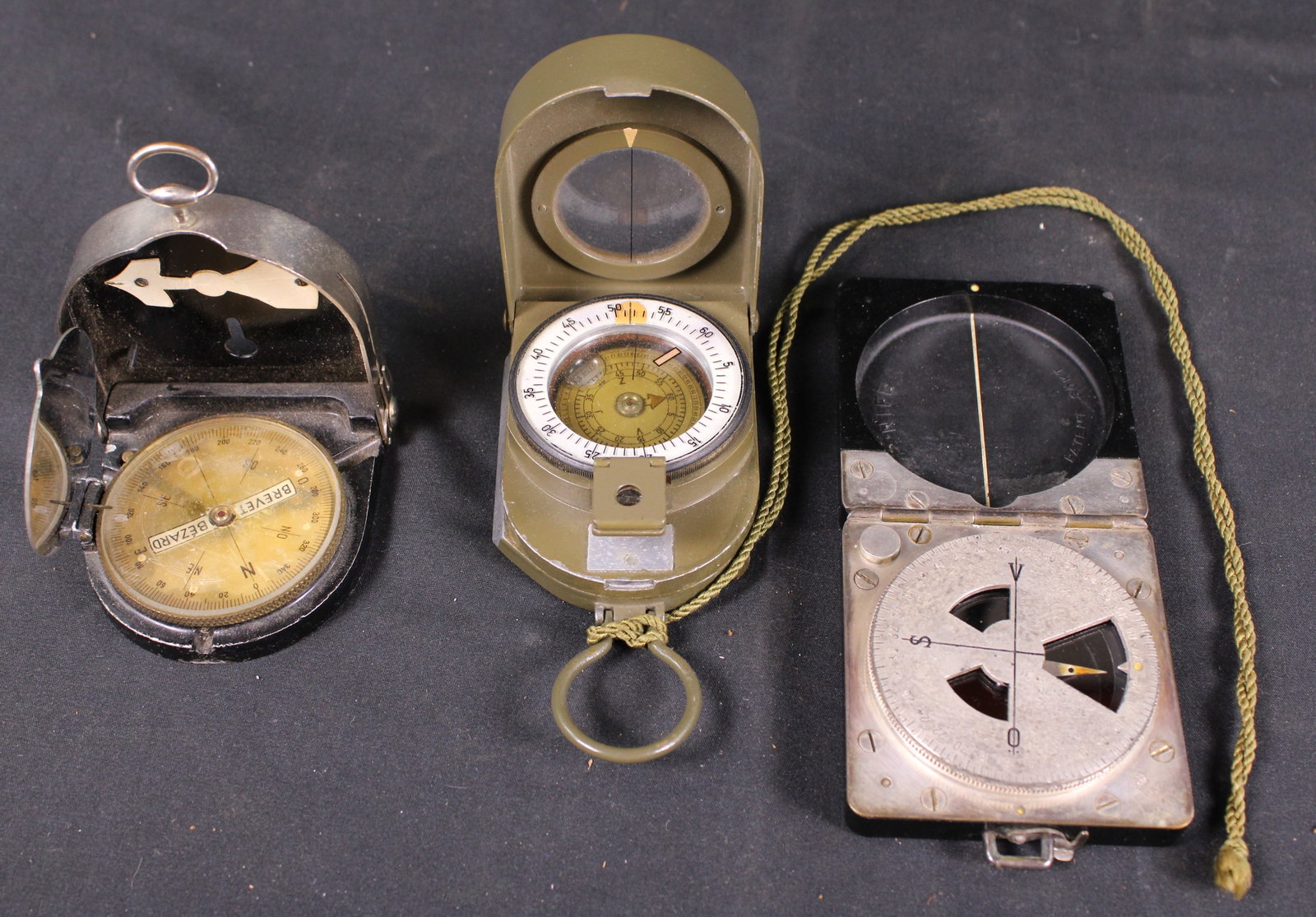 Group Lot of Military Compasses (KFC): Description coming soon! Bidders are welcome to preview items in person during our normal operating hours Tuesday through Saturday 11am-6pm. Estimated shipping parcel size (LxWxH) 10 inches x 10