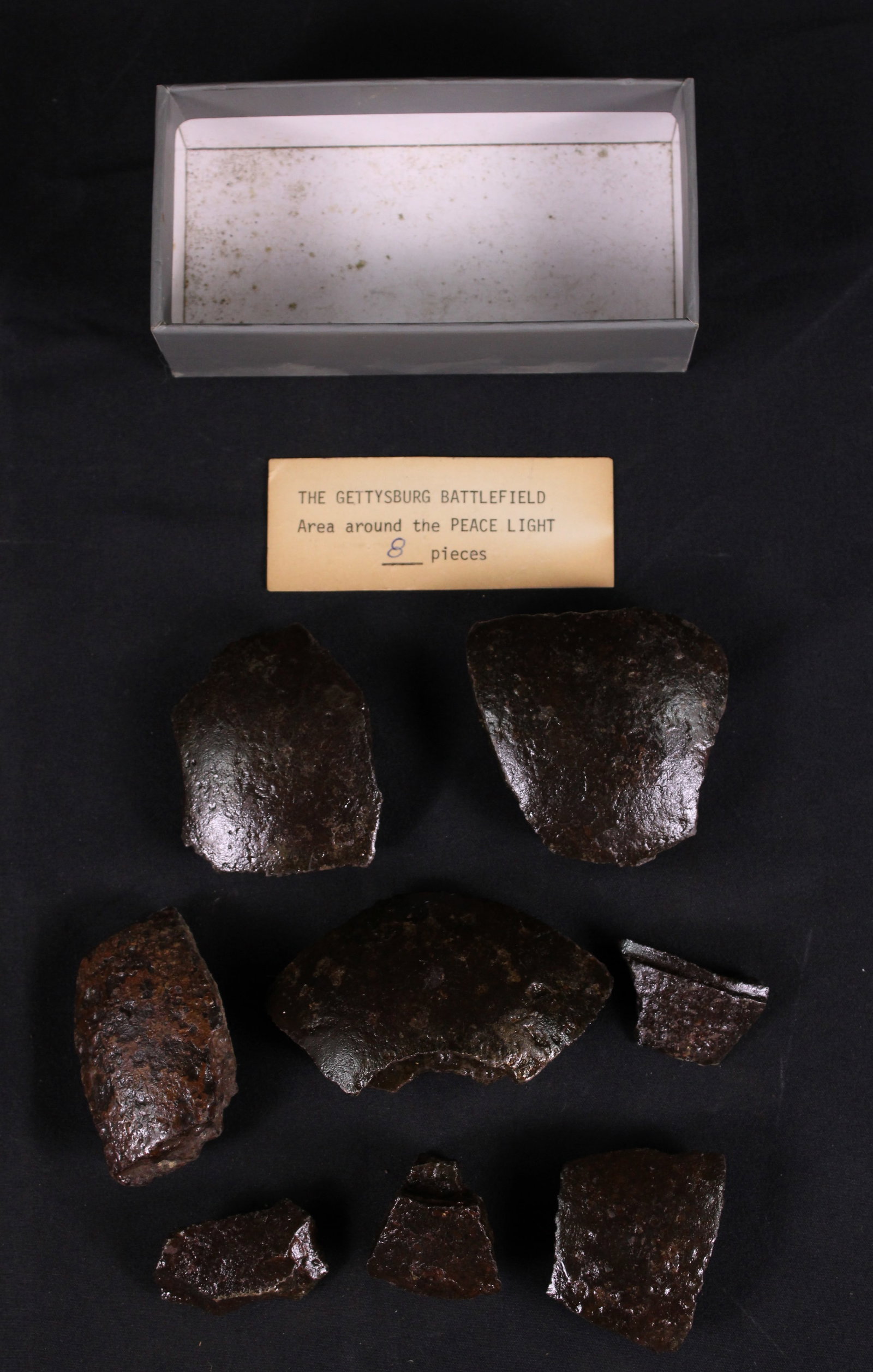 Gettysburg Battlefield Excavated Cannonball Shards (SNR): This lot of cannonball pieces was found around the peace light area on the Gettysburg Battlefield. These shards are in relic condition showing clear pitting, making these perfect for a