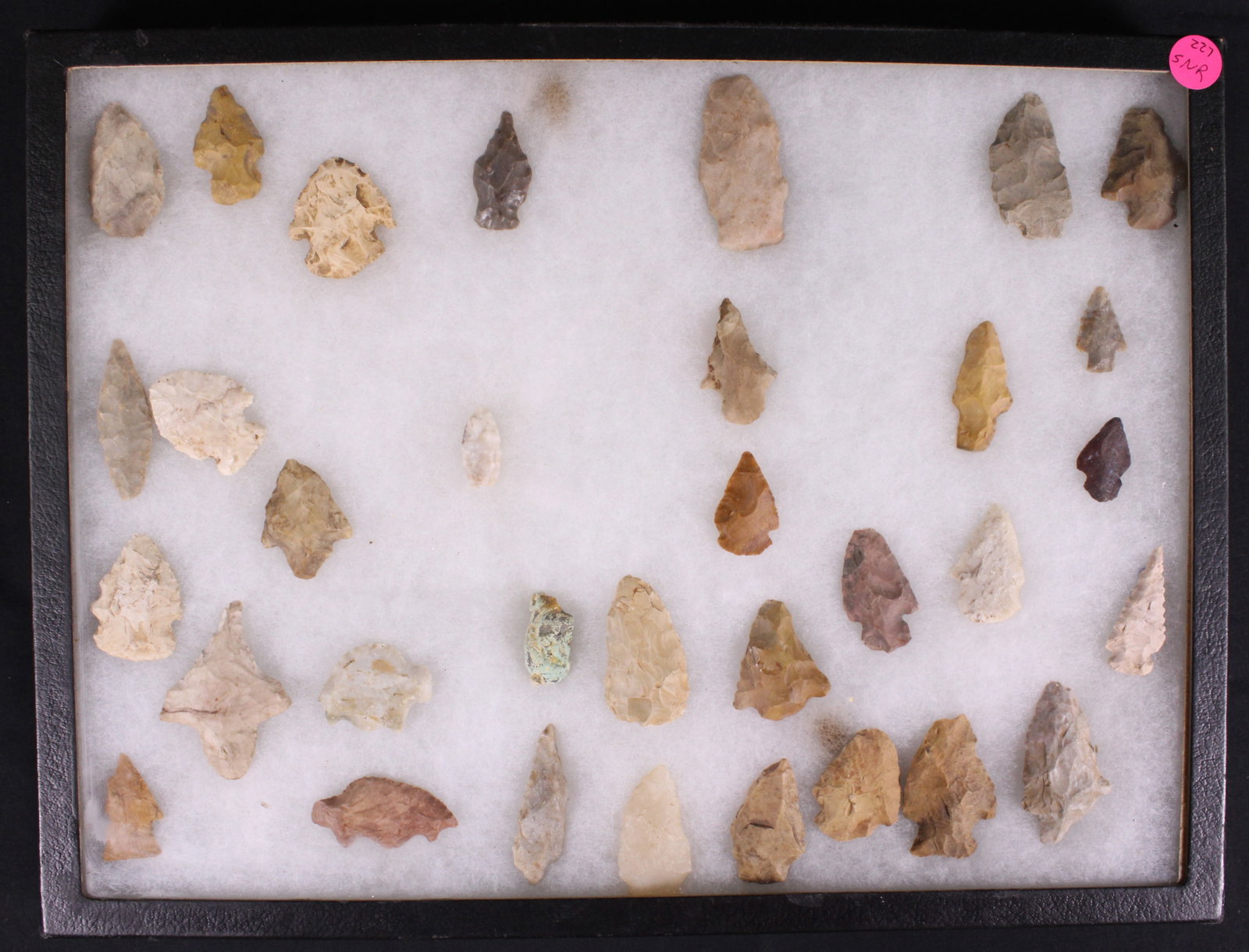 Native American Arrow Heads (SNR): A Riker box full of 23 various Native American spear heads made from various materials such as flint and other knapped materials. Riker box in very good condition with some minor bumps and