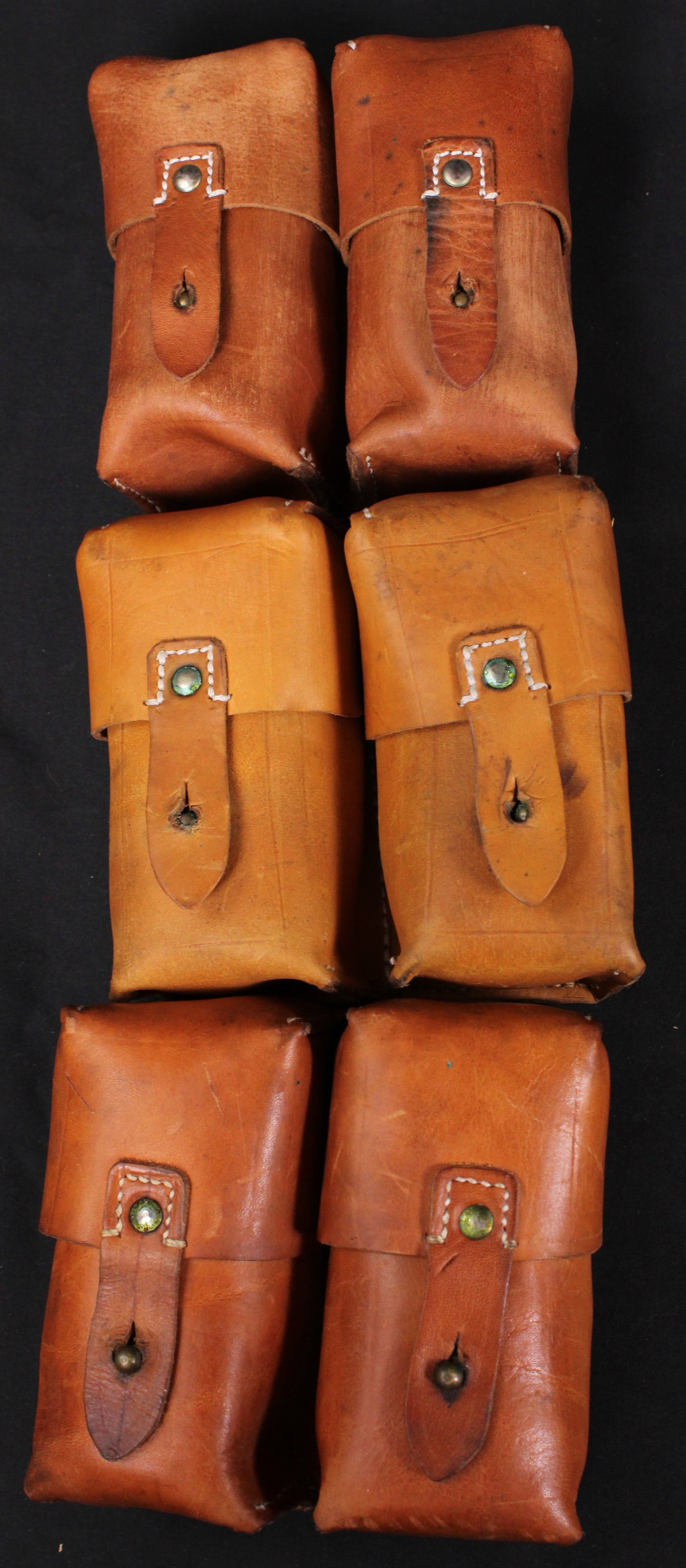 Three Yugoslavian Mauser Dual Ammunition Pouches (MAT): Description coming soon Bidders are welcome to preview items in person during our normal operating hours Tuesday through Saturday 11am-6pm. Estimated shipping parcel size (LxWxH) 12 inches x 8 inches