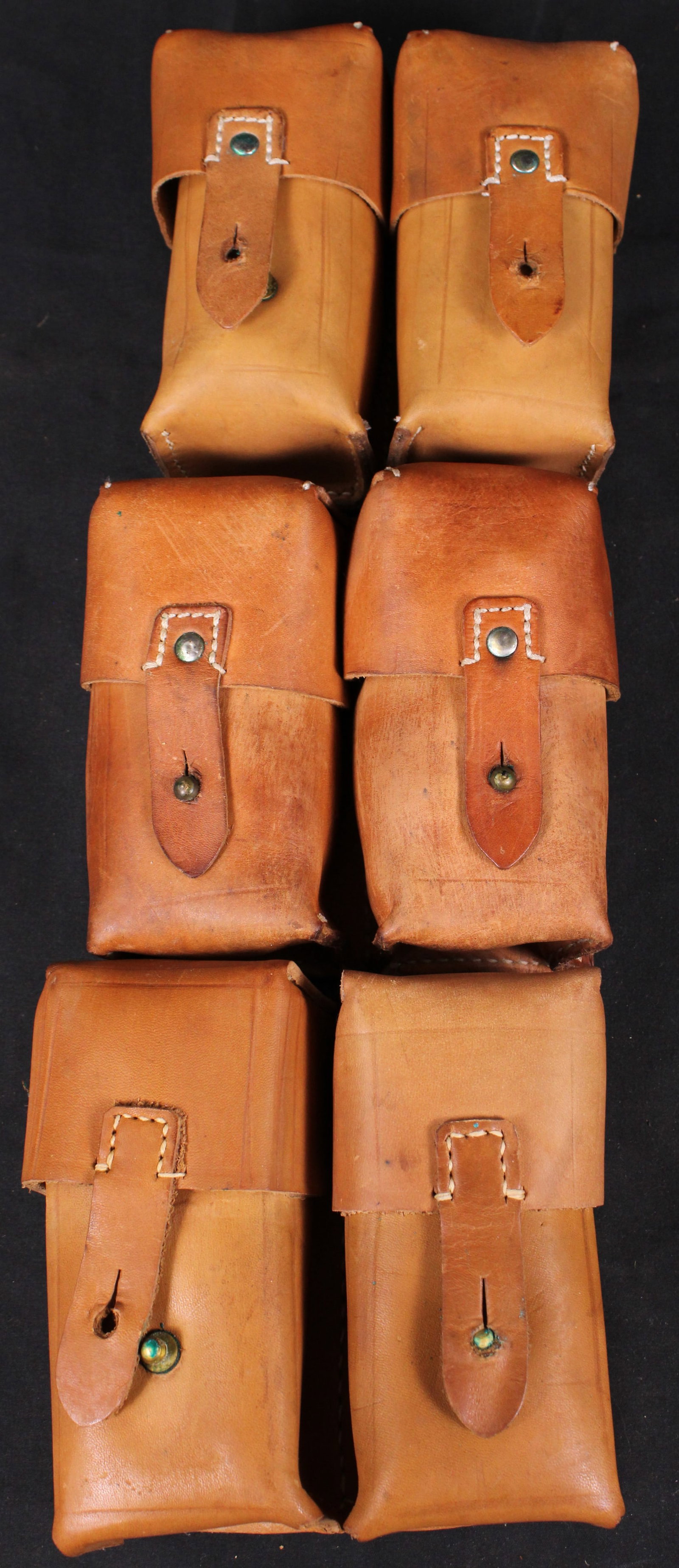Three Yugoslavian Mauser Dual Ammunition Pouches (MAT): Description coming soon Bidders are welcome to preview items in person during our normal operating hours Tuesday through Saturday 11am-6pm. Estimated shipping parcel size (LxWxH) 12 inches x 8 inches
