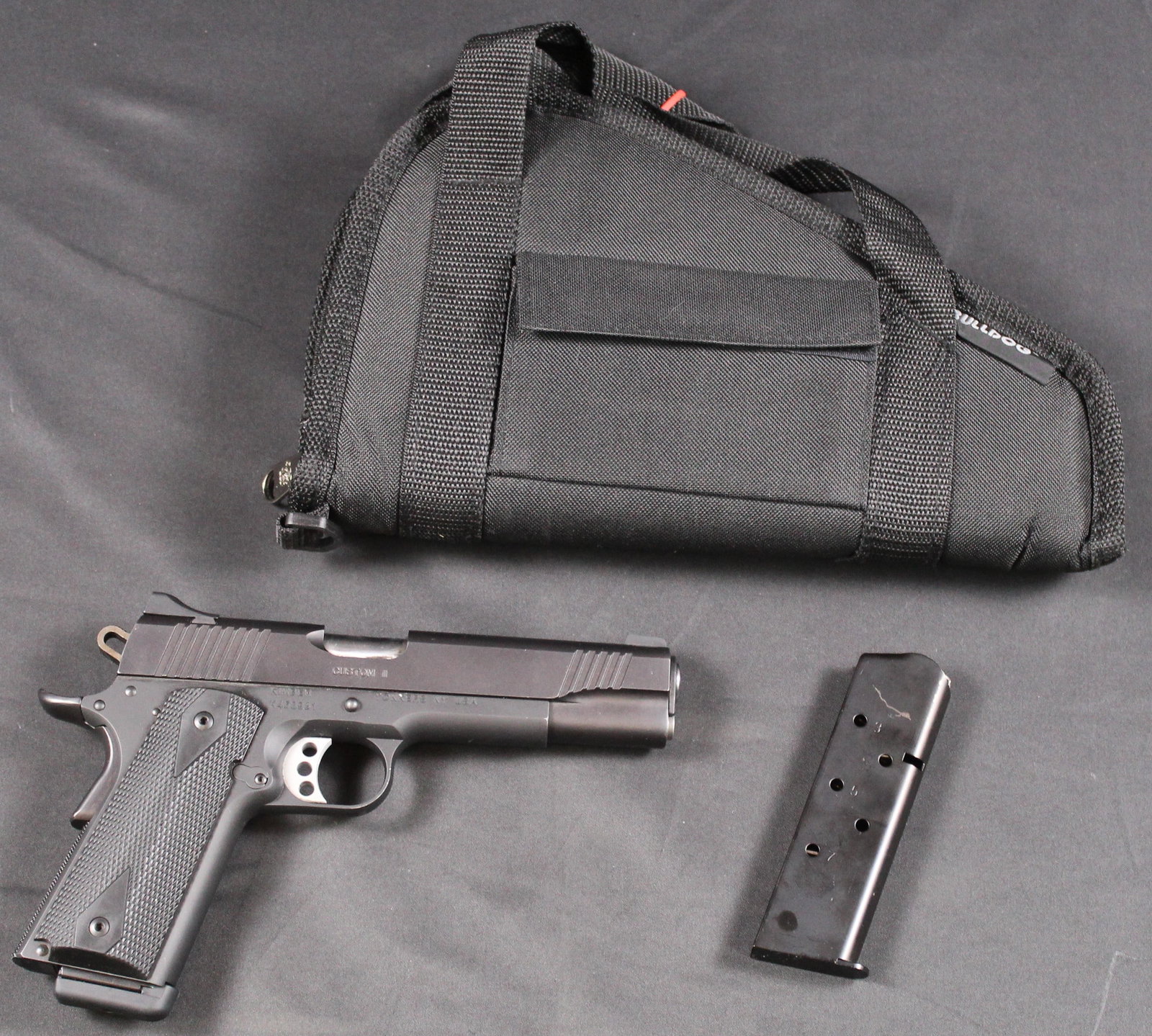 Kimber Custom II 1911 Chambered in .45 ACP Semi-Automatic Pistol FFL Required (HWE): A Kimber Model 1911 Custom II chambered in .45 ACP with two magazines and soft case in very good condition overall. The frame and slide are factory matte black and retain roughly 99% of their original