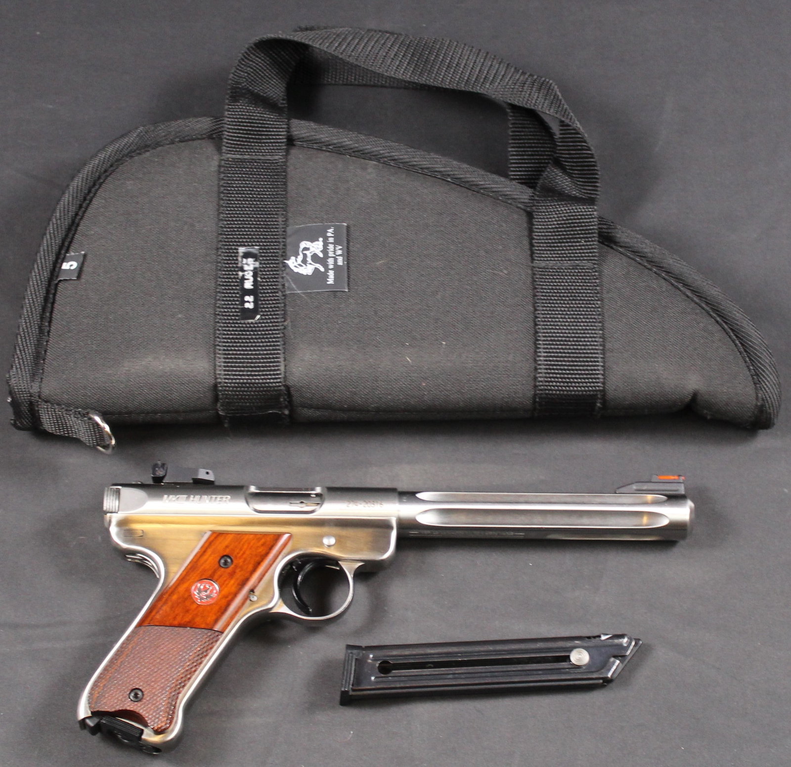 MkIII Hunter Ruger Semi-Automatic Target Pistol .22 Caliber FFL Required (HWE): A Ruger MkIII Hunter chambered in .22LR in very good condition overall with additional magazine and soft case. SN 274-20316. Frame and slide are made of stainless steel and have little-to-no handling 