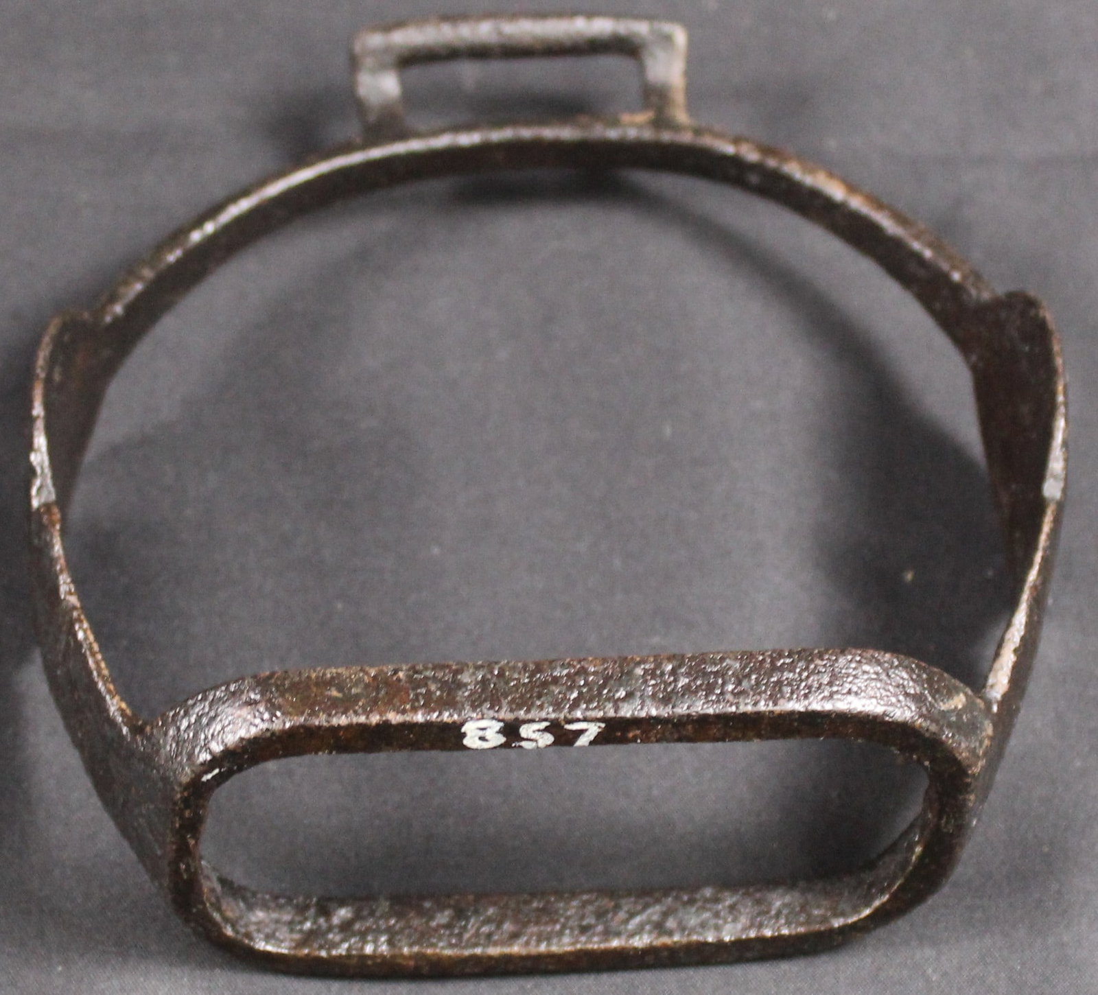 Ornate Early Cast Iron Stirrup (SNR): An ornate early (c.1700-1750) cast iron stirrup likely of US colonial origin. Designed to accommodate a 1.25-inch strap. Good condition overall. Bidders are welcome to preview items in person during