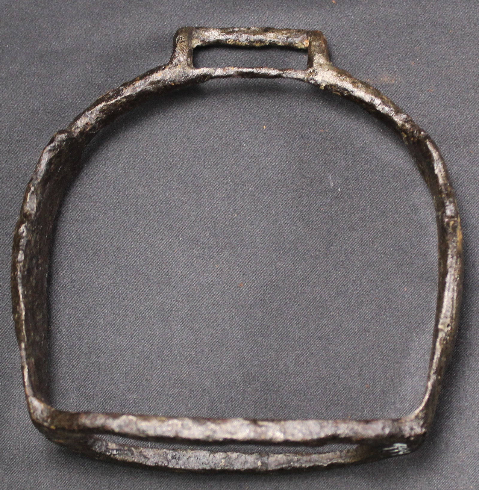 Cast Iron Stirrup c.1750-1780s Gravelly Springs, AL (SNR): A cast iron stirrup that was excavated from Gravelly Springs, Alabama dated to estimated 1750-1780s in good condition overall as a relic. The sides are ornate with embossments. Designed to