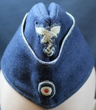 Rare Authentic WWII German Luftwaffe Overseas Cap (MME): A rare WWII German Luftwaffe overseas cap in good to very good condition overall. The Luftwaffe emblem and NSDAP insignia sits prominently on the front of the cap and appears to be original. The stitc