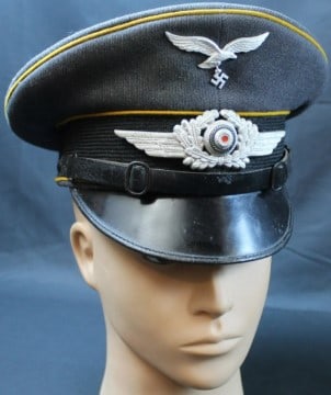 Rare WWII German Luftwaffe Schirmmutze Visor Cap (MME): This is a vintage WWII bring-back German Luftwaffe Schirmmutze visor cap in good condition overall with scattered signs of age including several small pin hole sized holes featured throughout the pict