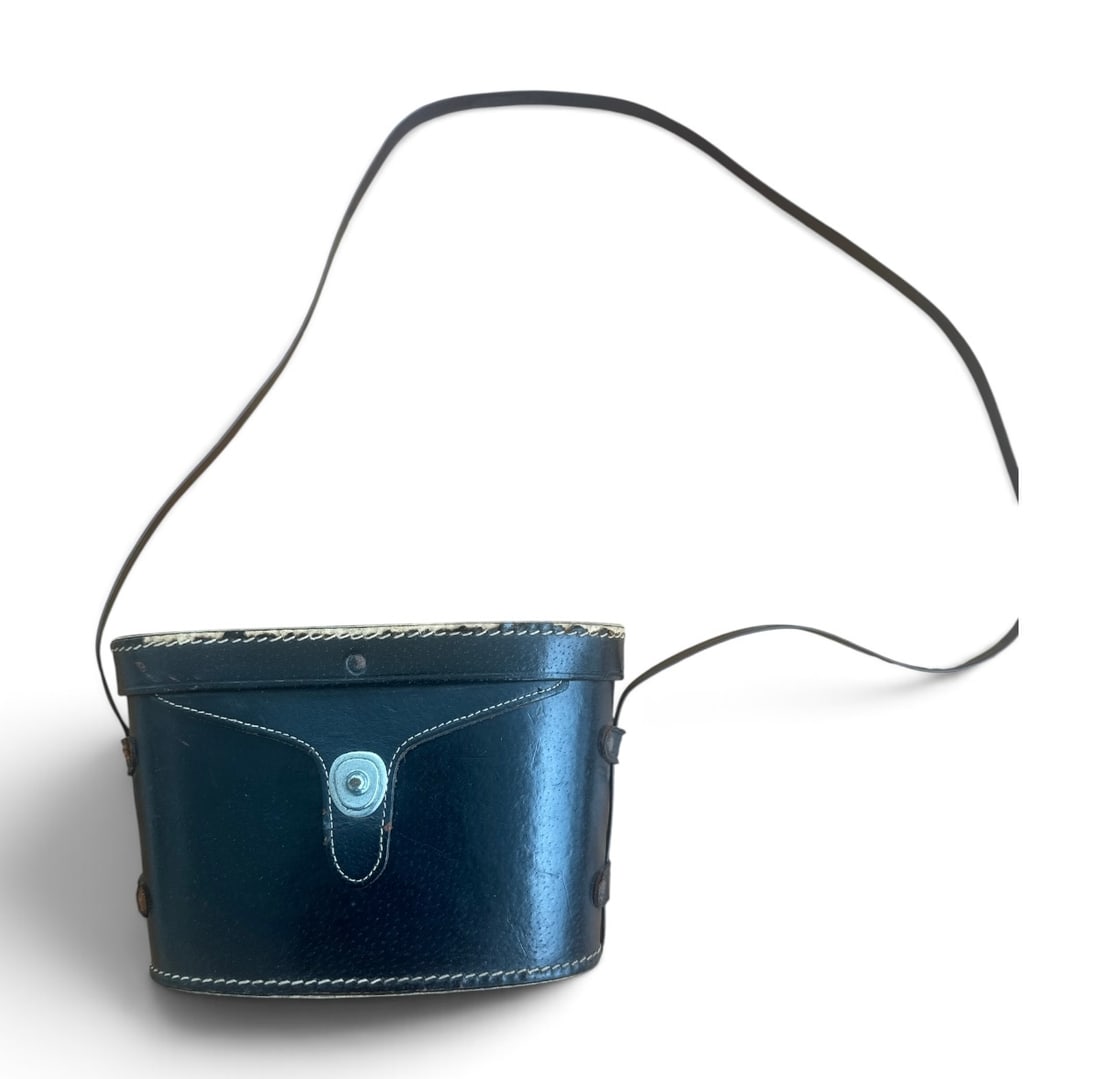 Vintage TascoModel Type 7 Binoculars: Brand: TascoModel Type: 7 x 35mm Feather Weight / Wide AngleFeatures: Fully coated optics, magnesium body design, and an original lined leather case featuring the classic Tasco logo on the inner lid.