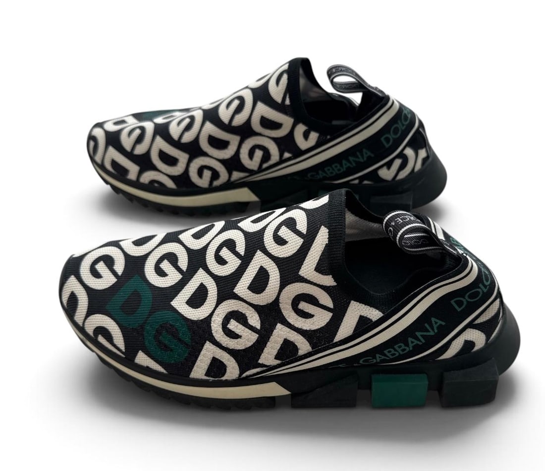 Dolce & Gabbana Sorrento Melt slip-on Sneakers: Dolce & Gabbana Sorrento Melt slip-on sneakers, featuring a striking all-over black and white DG logo print with green accents. Excellent condition. Size:41