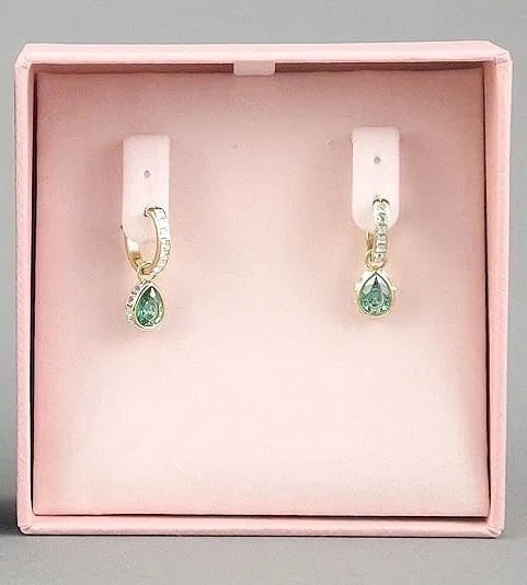Swarovski Small Hoop Earrings with Green Crystal Drop w/ Box: Swarovski Small Hoop Earrings with Green Crystal Drop, Box Offered is a pair of Swarovski earrings featuring small hoop-style drops accented with a green teardrop crystal. The color pop is refined and