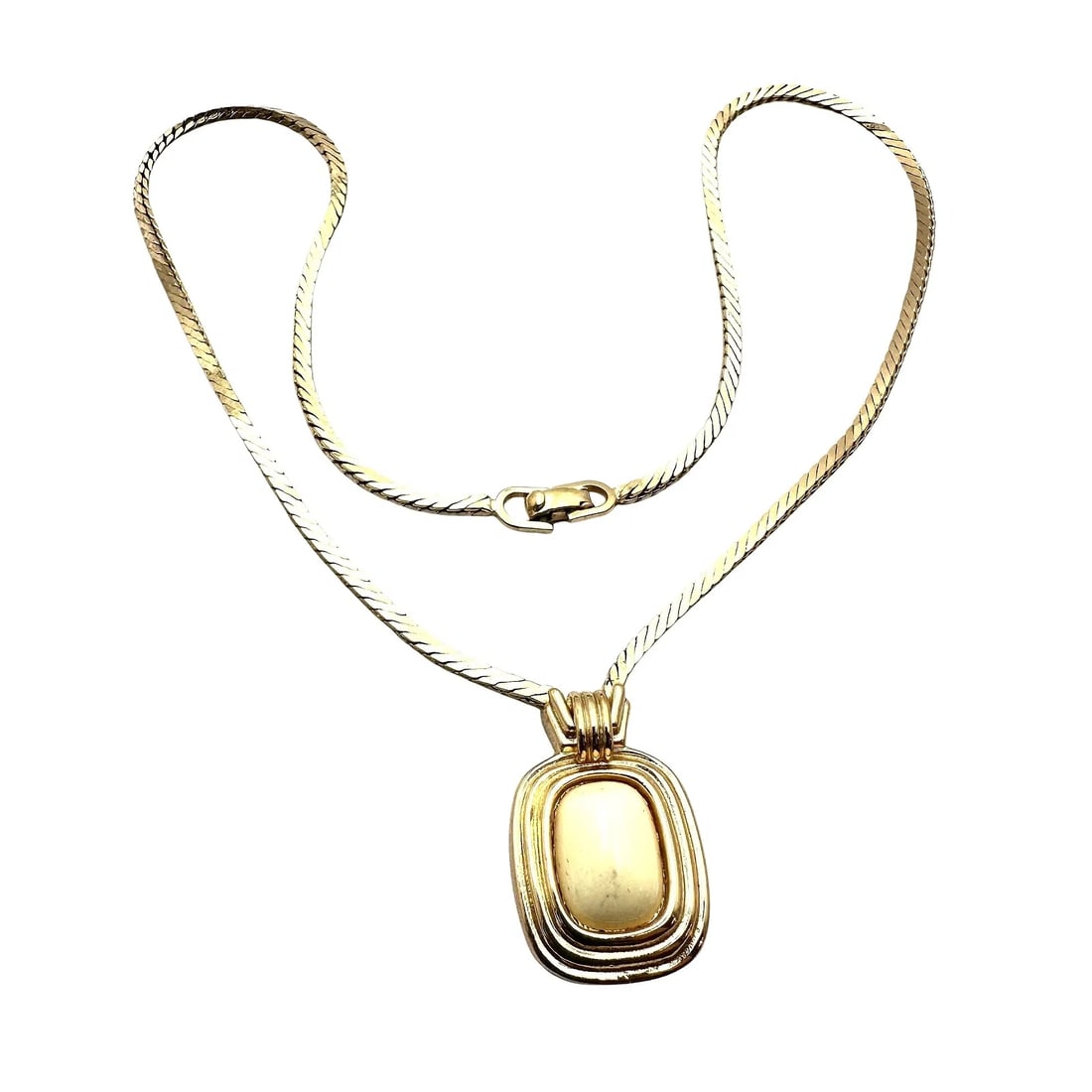 Christian Dior Vintage Off-White Pendant Necklace and Gold-Tone Chain 16": Vintage Christian Dior Off-White Pendant Necklace Offered is a vintage Christian Dior necklace featuring an off-white pendant on a gold-tone chain. The contrast of the creamy pendant with warm metal g