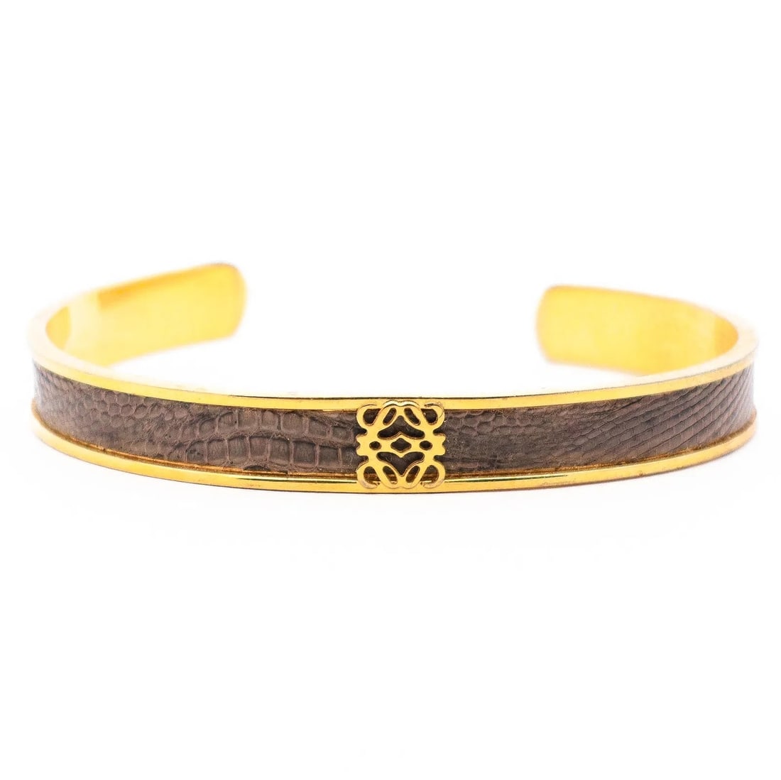 Loewe Logo Motif Gold-Tone & Enamel Cuff Bangle: Authentic Loewe open cuff bangle in gold tone with enamel detailing and a centered Loewe logo motif. Clean, modern branded look, easy to stack or wear solo. Comes with box. Highlights Marked LOEWE / M