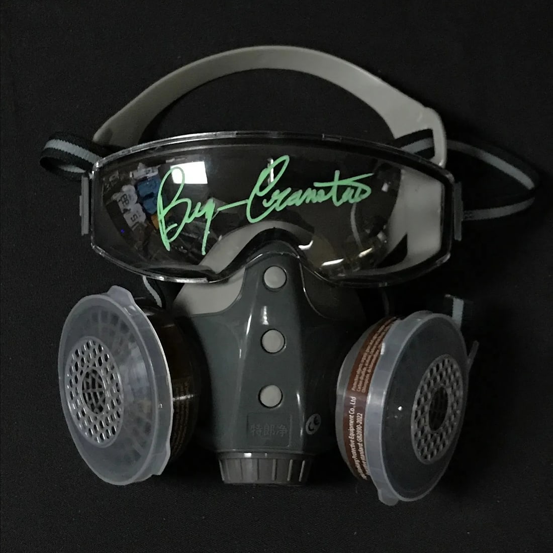 Bryan Cranston Signed Breaking Bad Gas Mask COA: Autographed "Breaking Bad, style" respirator/gas mask with goggles, signed by Bryan Cranston in green paint pen across the goggle lens area. Includes KB COA. Highlights Bryan Cranston autograph (green