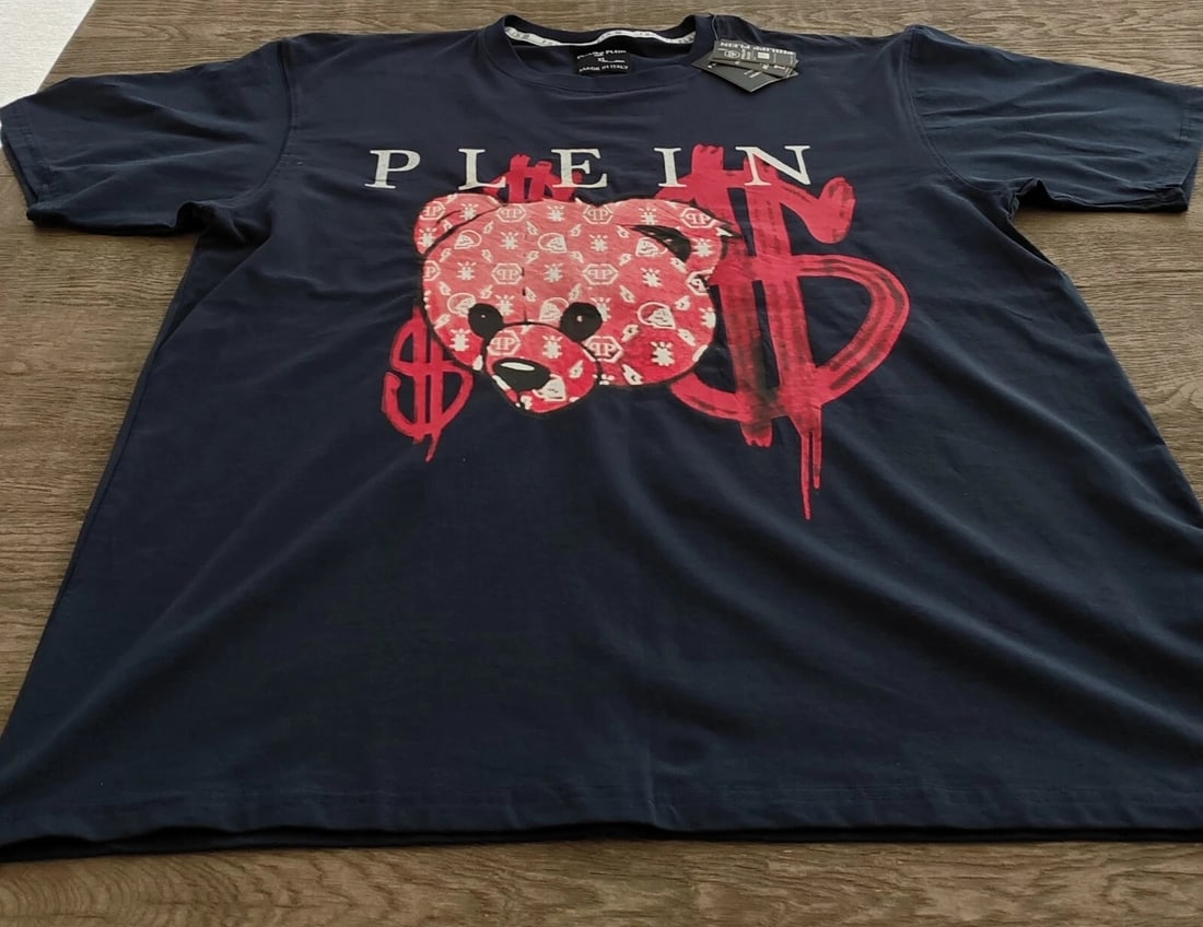 Philipp Plein Teddy Tee XL Italy (NWT): Men's Philipp Plein crewneck T-shirt in dark blue, made in Italy, size XL. Features the brand's signature "Plein Teddy" attitude with money-themed graphic / leather-patch styling. A strong statement t
