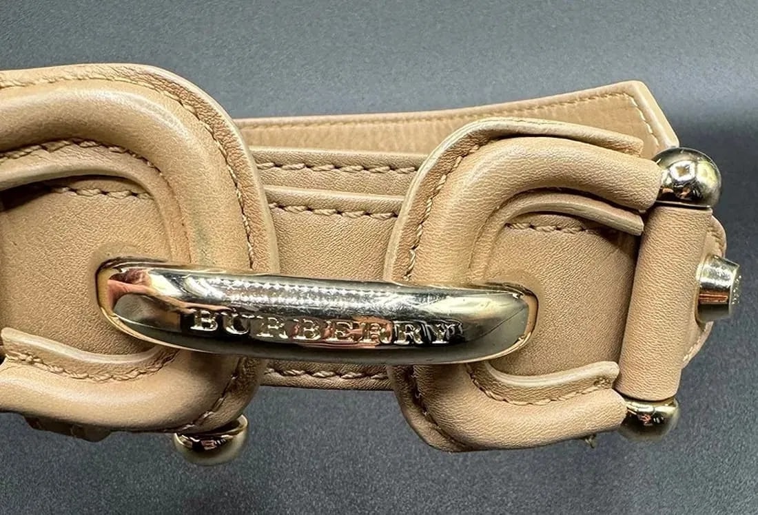 Burberry Refined Leather Belt w/ Polished Metal Hardware 42" Like New: Refined leather belt by Burberry, featuring smooth leather construction and polished metal hardware. The belt presents a clean, understated design consistent with Burberry's classic aesthetic. The bel