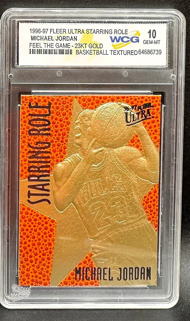 1996-97 Fleer Ultra Starring Role Michael Jordan 23KT Gold "Feel The Game" – GEM MT 10: An exceptional sports collectible: a pristine WCG GEM MINT 10 example of Michael Jordan's 1996-97 Fleer Ultra Starring Role "Feel The Game" 23KT gold commemorative. The composition features a bold, ov