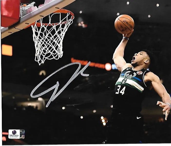 GIANNIS ANTETOKOUNMPO – Milwaukee Bucks Autographed 8" x 10" Photograph – GAI Authentic: A high-impact masterclass in vertical dominance: this 8" x 10" color photograph captures Giannis Antetokounmpo in a signature "Greek Freak" moment, ascending for a powerful rim-rattling dunk. Executed