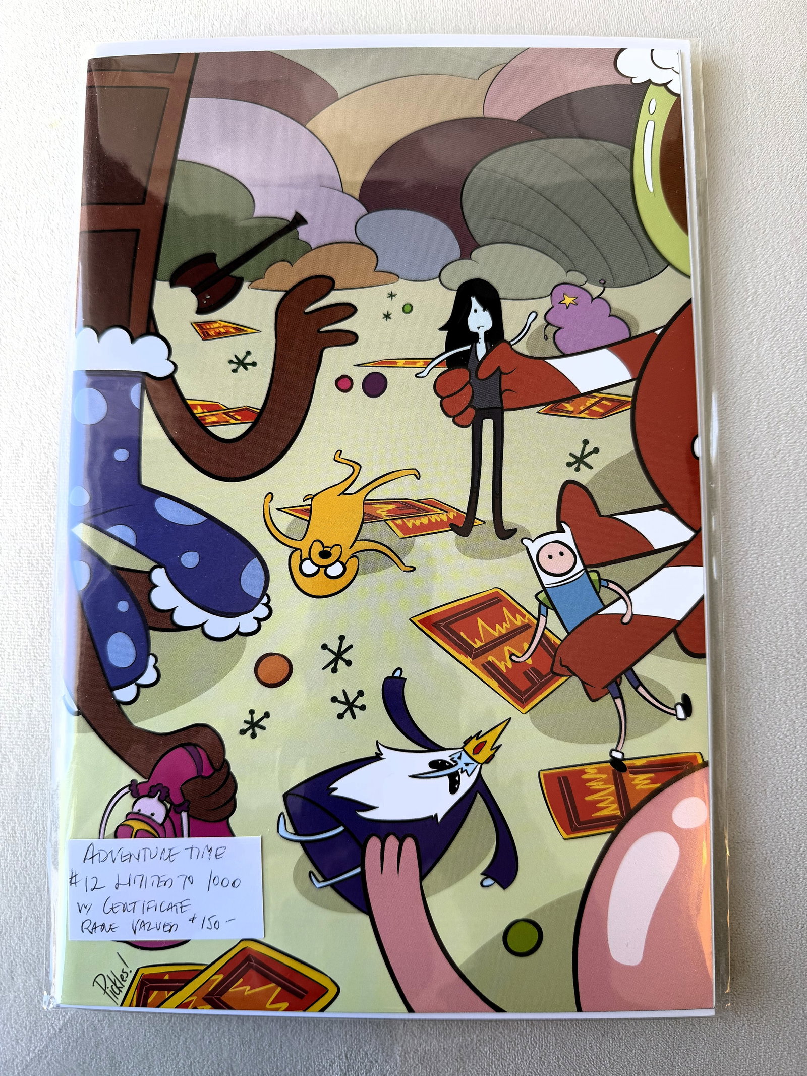 Adventure Time #12 (2013) "The Golden Age of Ooo" Dynamic Forces Exclusive Variant (836/1000) COA: A rare opportunity to acquire a centerpiece from the "Golden Age" of Boom! Studios' most successful franchise. This Adventure Time #12 (2013) Exclusive Variant is an individually hand-numbered limited