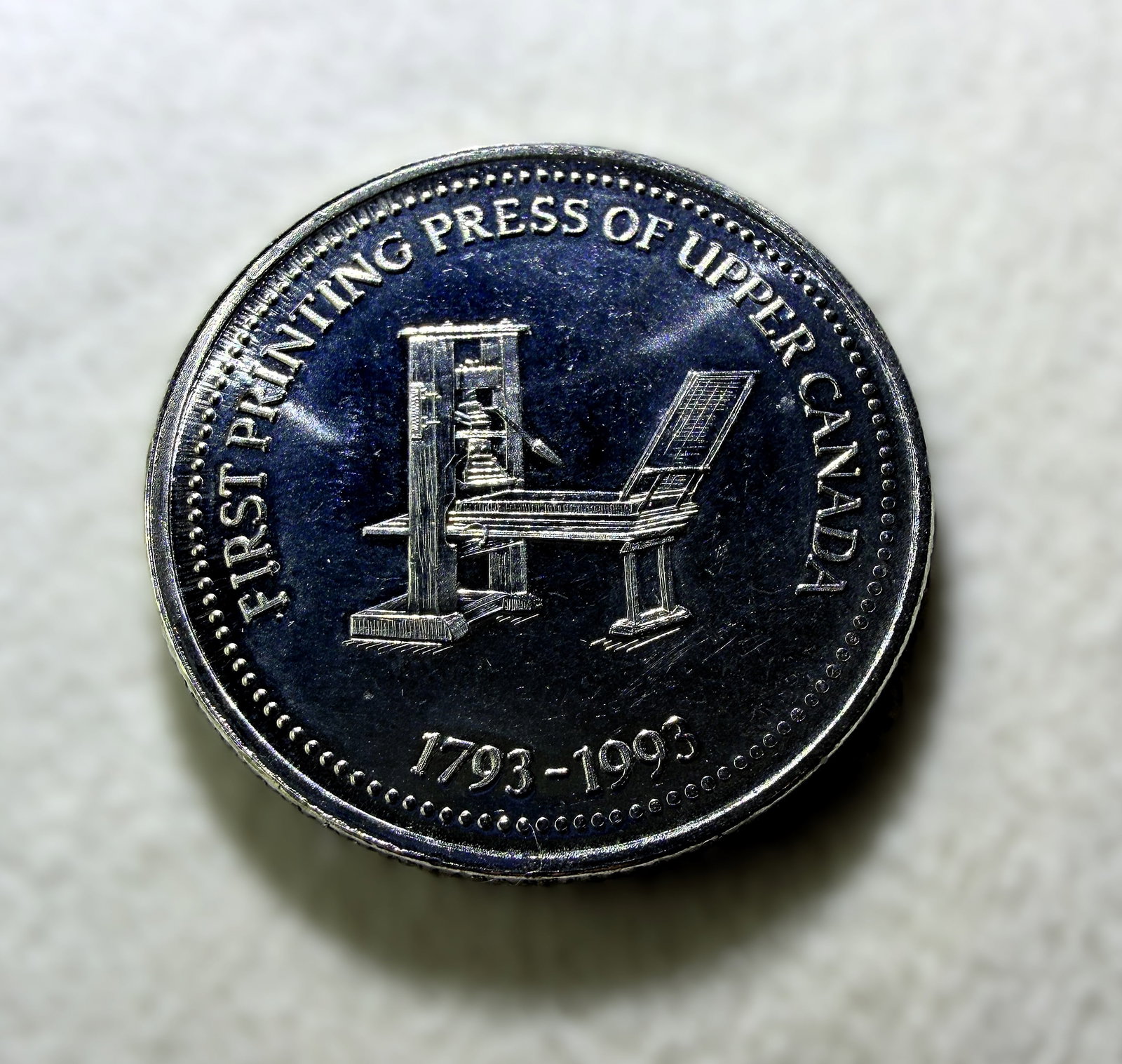 1993 Niagara-on-the-Lake Ontario Bicentennial Commemorative Dollar Token: 1993 Niagara-on-the-Lake, Ontario Bicentennial Commemorative Dollar Token – This commemorative token was issued in 1993 honoring Niagara-on-the-Lake and features a detailed printing press design. Me