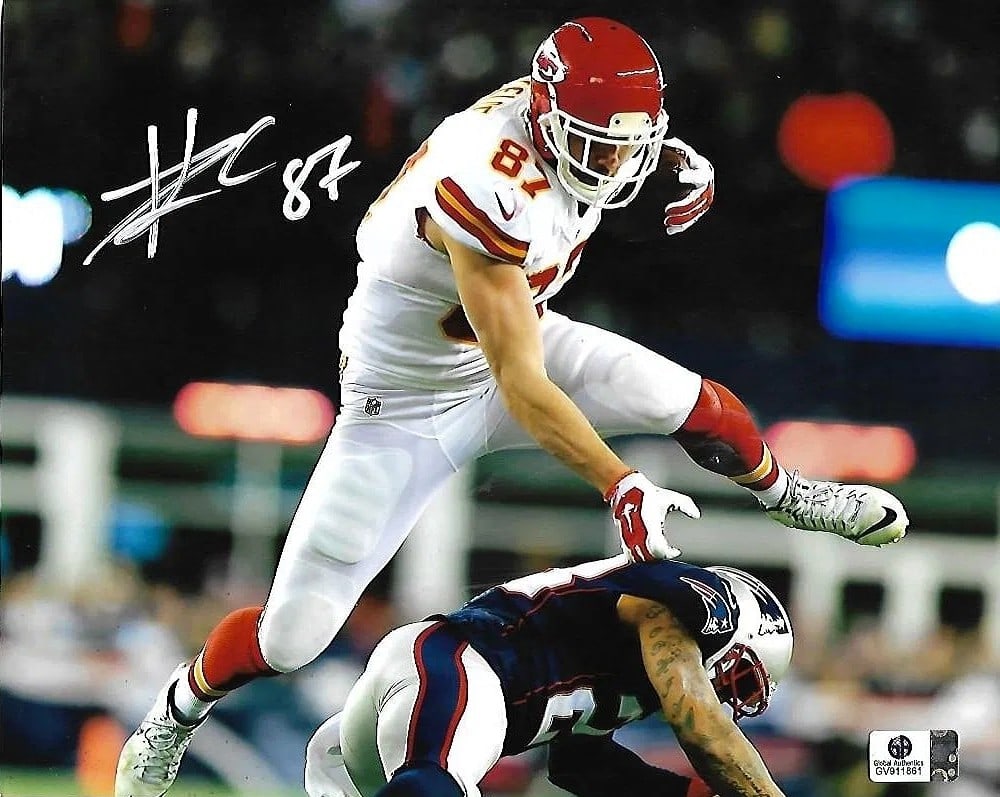 Travis Kelce Autographed Kansas City Chiefs 8"x10" Photo w/ GA COA: Autographed 8x10 photo of Travis Kelce with the Kansas City Chiefs. Includes Global Authentics (GA) COA/hologram. GA provides certificate/number verification via its certification check. Highlights Si