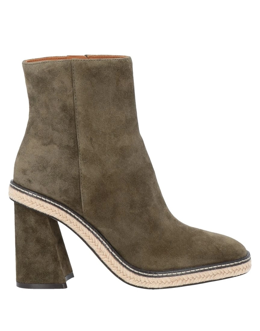 Tory Burch Olive Suede Flared-Heel Espadrille Ankle Boots – US 8.5 – NIB: A refined statement from Tory Burch: these elevated ankle boots are crafted in a rich olive-green suede, merging modern architectural structure with artisanal textural contrast. The silhouette is defi