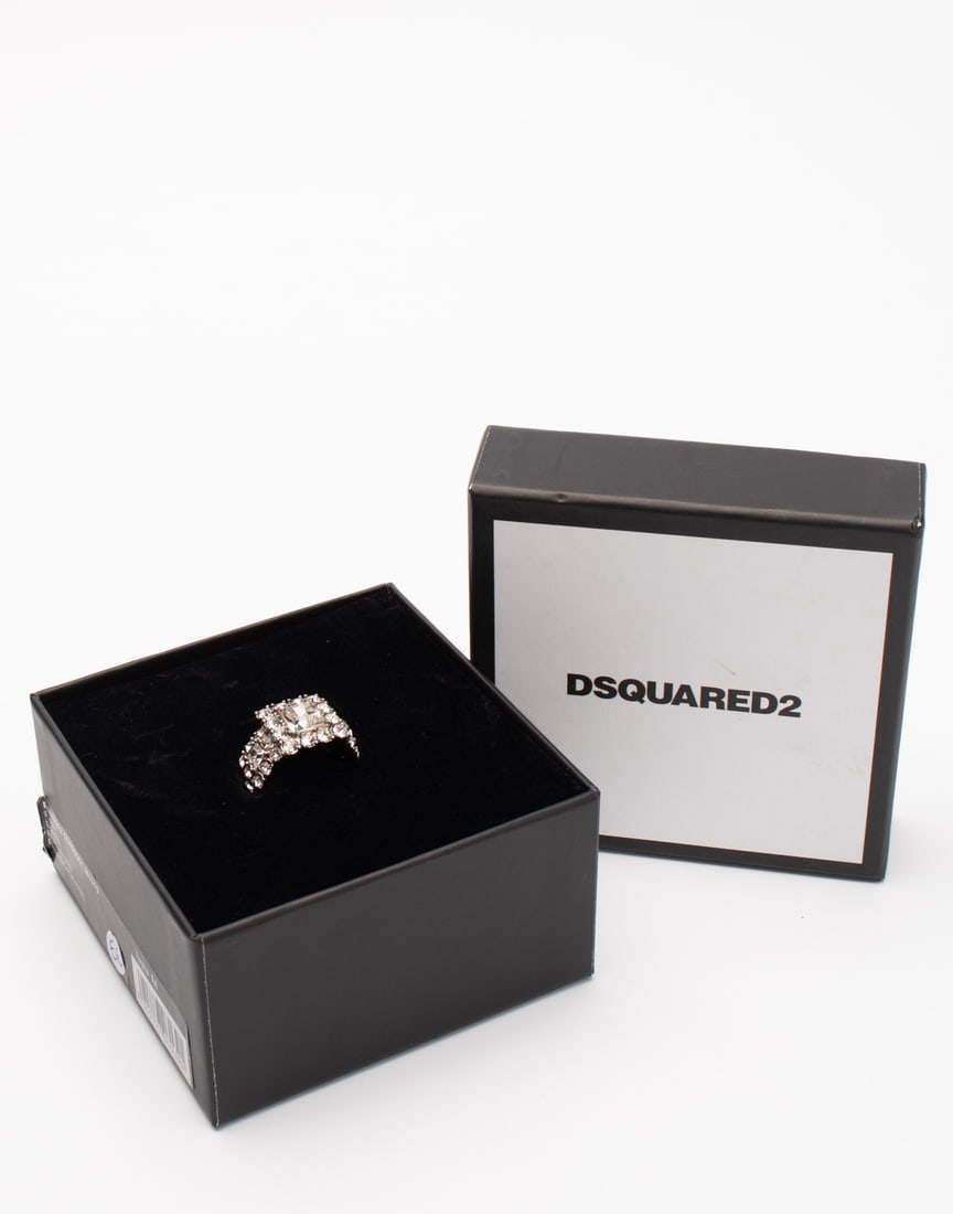 IMPORTED MSRP €220 DSQUARED2 Cocktail Ring Size S UK-L 1/2 52 Rhinestones Made in Italy NWT: DSQUARED2 cocktail ring in silver-tone metal featuring rhinestone embellishments and logo detailing. Italian-made statement jewelry piece designed with bold contemporary styling and reflective crystal