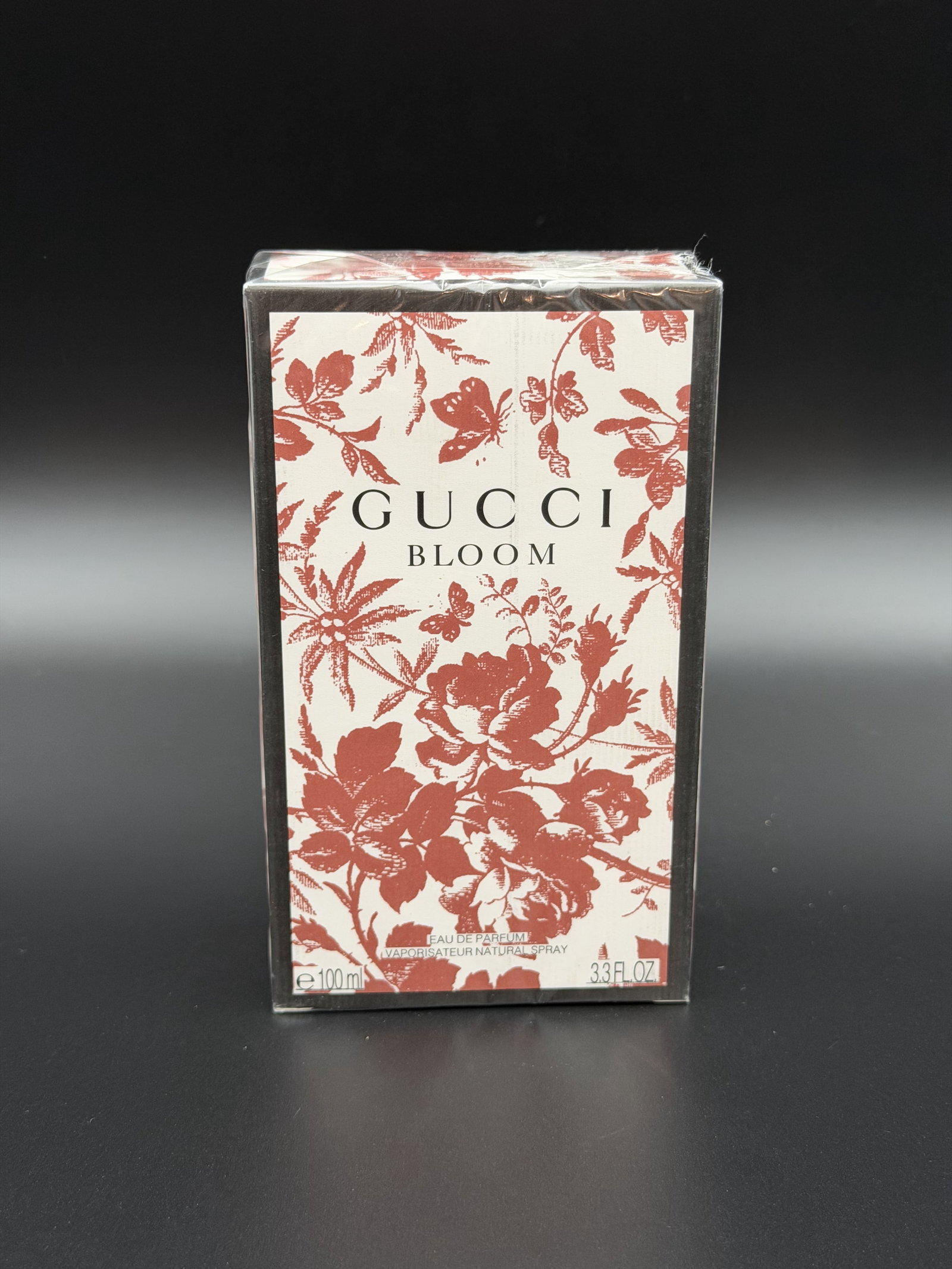 IMPORTED MSRP €172 GUCCI Bloom Eau de Parfum 100mL Sealed NIB: GUCCI Bloom Eau de Parfum fragrance presented in a factory-sealed 100 mL (3.3 fl oz) retail box. Packaging bears Gucci Bloom branding with floral motif exterior design and identifies the contents as E