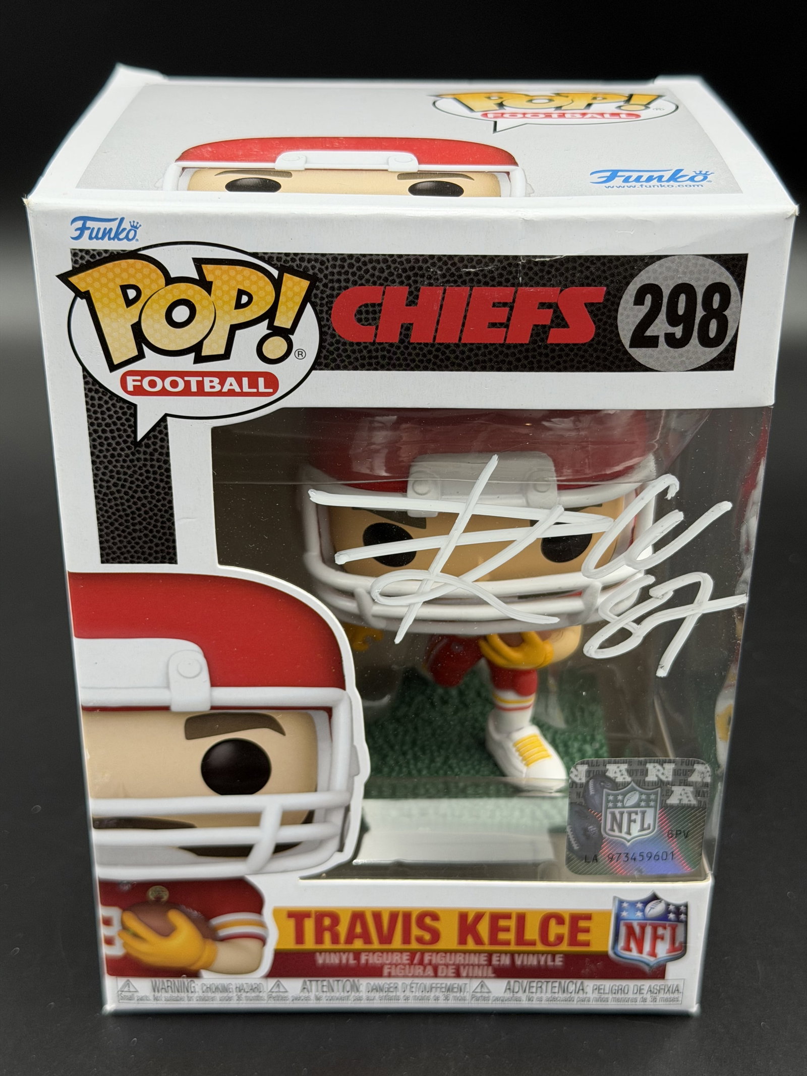 Travis Kelce Signed Funko Pop! Chiefs #298 – ACE COA: A Funko Pop! Football #298 vinyl figure depicting Travis Kelce of the Kansas City Chiefs, signed boldly across the front window in white ink. The piece includes ACE authentication with hologram verifi