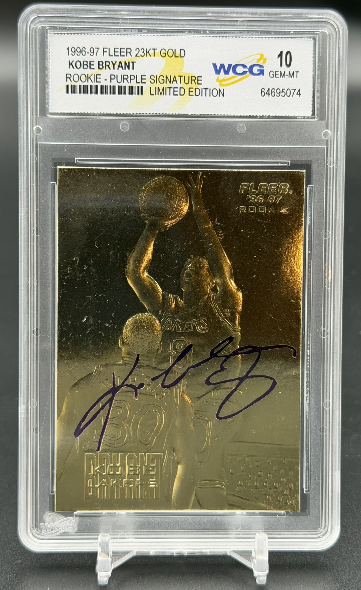 1996-97 Fleer 23KT Gold Kobe Bryant Purple Signature WCG 10 Gem-MT Rookie Card Serial #68614: 1996-97 Fleer 23KT Gold Kobe Bryant rookie-era card featuring a facsimile purple signature, professionally graded WCG Gem-MT 10. Designated as the "Rookie - Purple Signature Limited Edition," the fron