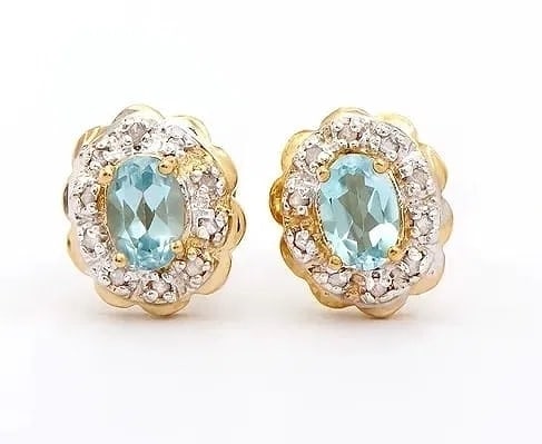 MSRP $895 1.30 Ct Blue Topaz Diamond 18K Gold Plated Earrings: Bright, feminine earrings featuring sky-blue topaz stones accented with diamonds for extra sparkle. Details: Total Gem Weight: 1.30 ctw Blue Topaz: 2 sky blue oval stones, 6x4mm, 1.12 ctw Diamonds: 20