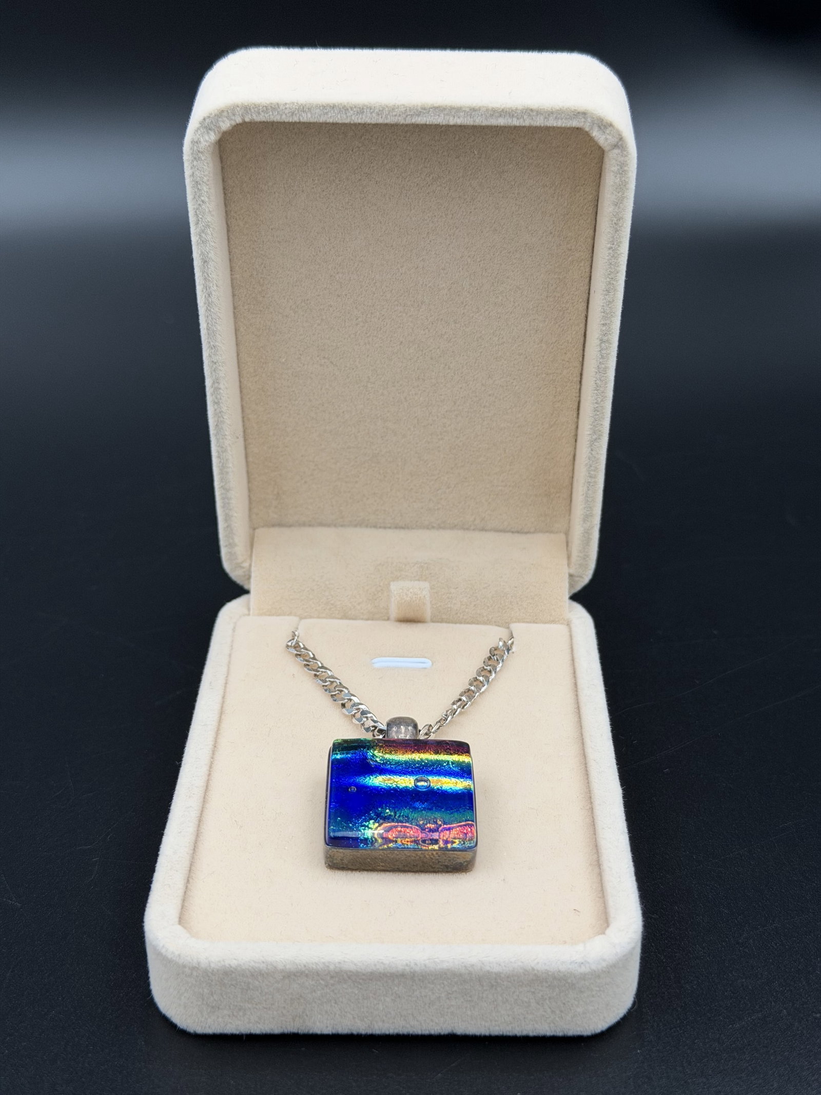 MSRP $695 PAUL LUX Sterling Silver 925 Dichroic Glass Pendant Necklace 19.7 g Italy w/ Box: Paul Lux pendant necklace featuring a rectangular dichroic art-glass cabochon displaying vivid iridescent blue, green, purple, and gold coloration within a sterling silver setting. Suspended from a su