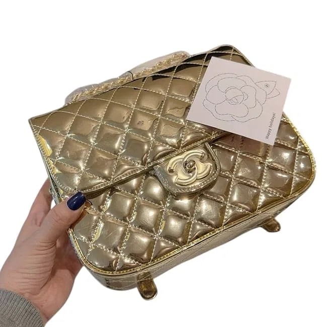 MSRP $5,500 CHANEL Metallic Gold Quilted Beauté Backpack & Matching Star Pouch NIB (Una: PLEASE READ: This item has not been authenticated by Atomic Pear. Please ask absolutely any questions or request additional photographs before you bid. Thank you! Love, Atomic Pear A high-impact maste