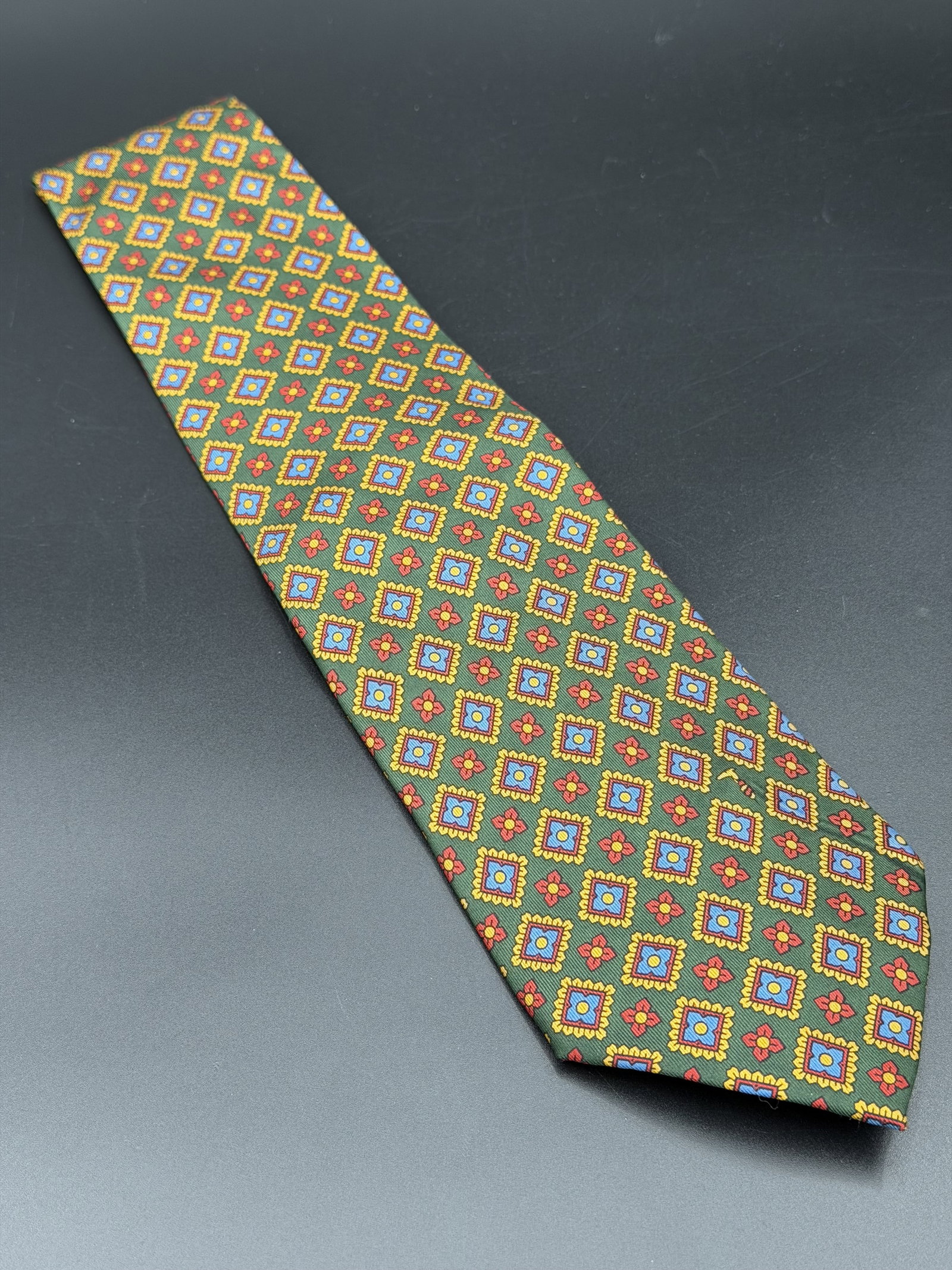EST. OG VALUE $350+ VINTAGE TRUSSARDI 100% Silk Italian Necktie Green Geometric Medallion Made in (U: PLEASE READ: This item has not been authenticated by Atomic Pear. Please ask absolutely any questions or request additional photographs before you bid. Thank you! Love, Atomic Pear Offered is a vintag