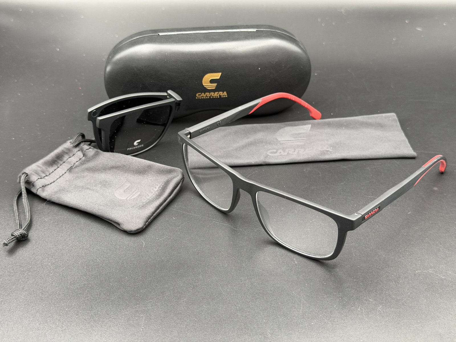 MSRP $389 Carrera 8053/CS Magnetic Clip-On Polarized Eyeglasses Matte Black Red 55□17-145 NWOT: Enjoy the versatility of prescription-ready eyewear and polarized sunglasses in one premium package with these Carrera 8053/CS magnetic clip-on eyeglasses. Finished in matte black with distinctive red