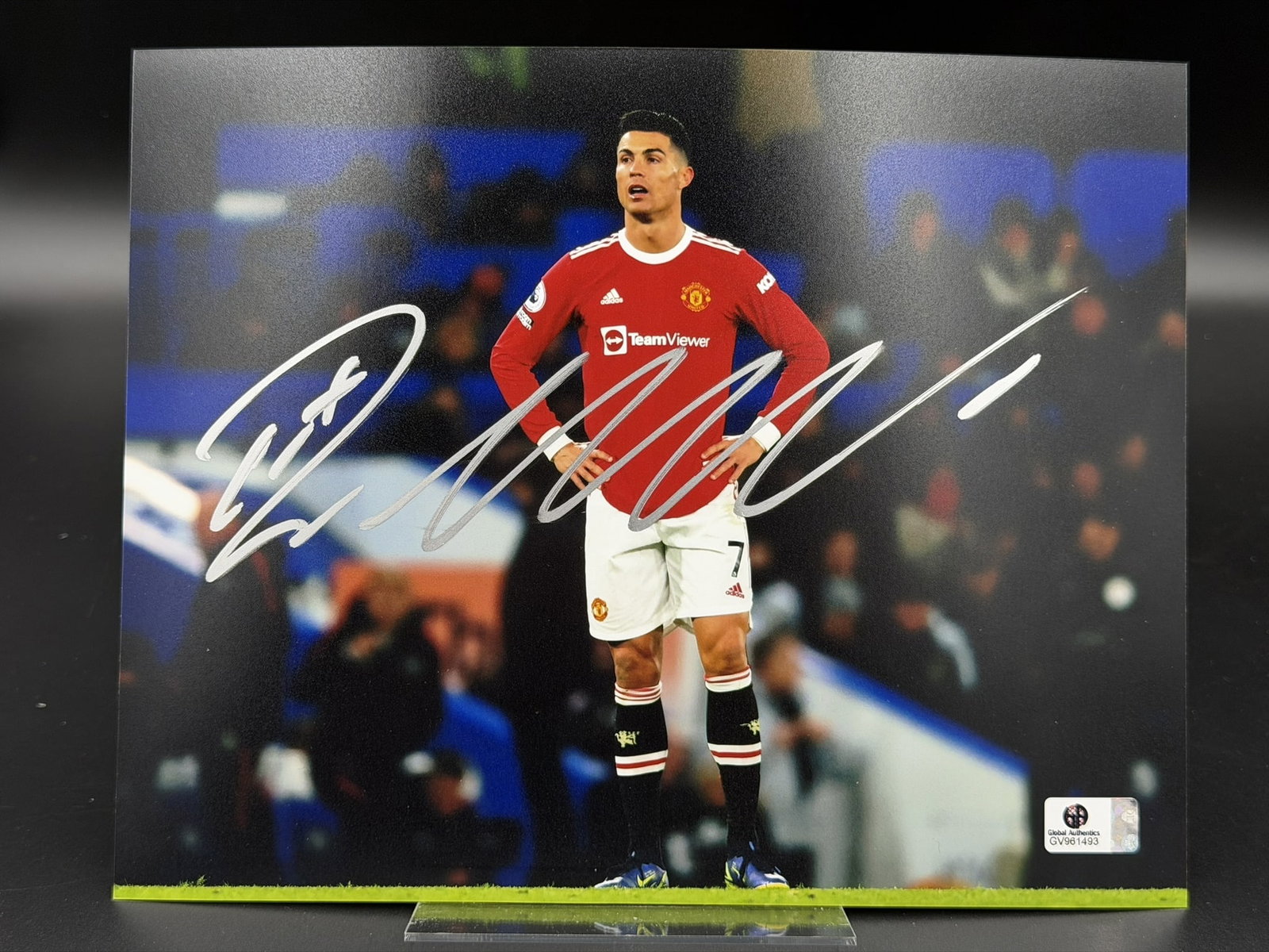 Cristiano Ronaldo Signed Manchester United Photo GA COA 8" × 10": Official color photograph personally signed by Cristiano Ronaldo in silver marker across the front. The image captures Ronaldo during his second spell with Manchester United, wearing the club's iconic